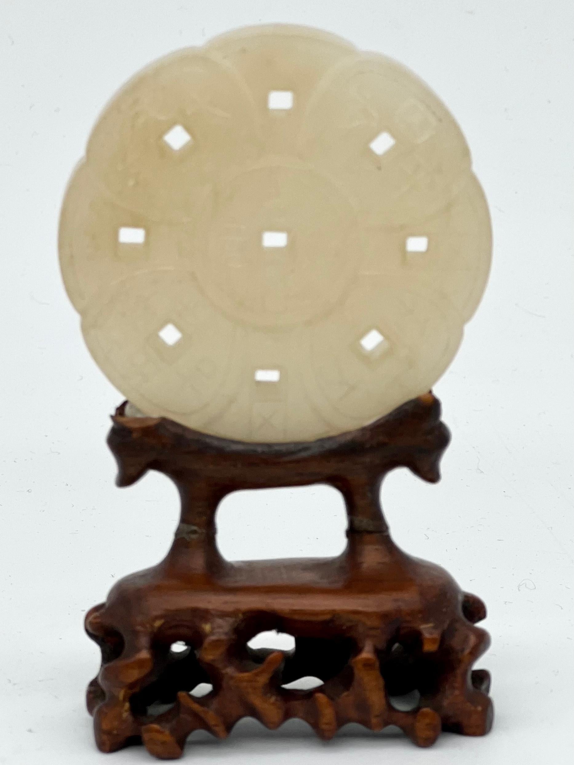 A Magnificent Antique Chinese Natural Nephrite Jade Plaque . 19th C

A CHINESE CELADON NEPHRITE JADE PLAQUE


Late 19th /early 20th Century



The foliate plaque incised with various characters.


Wooden stand included.


5.4cm in diameter.


In