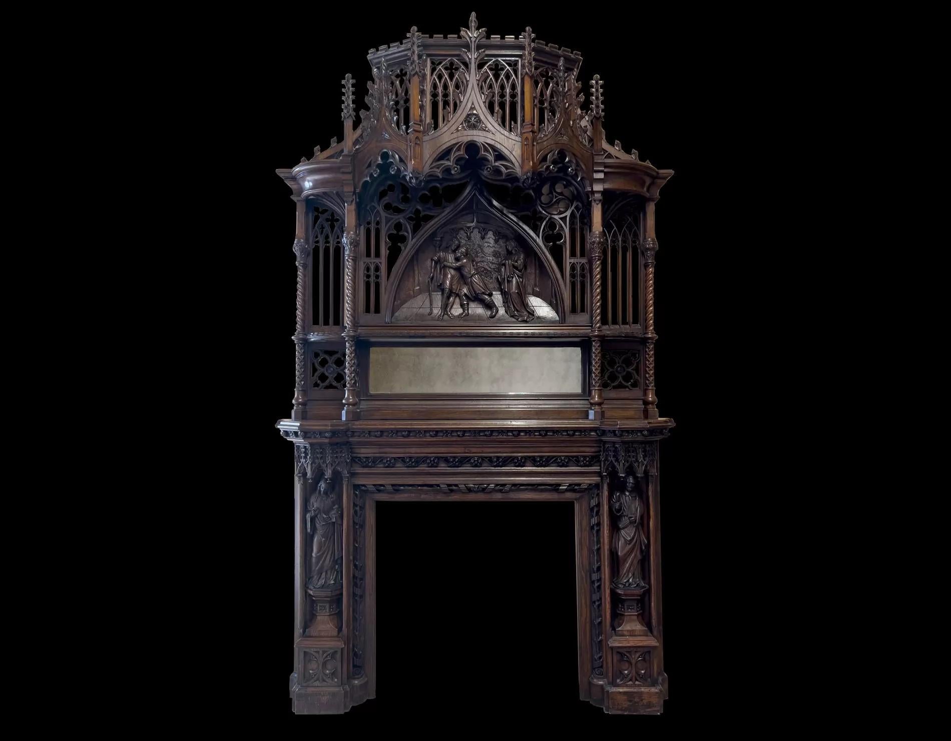 A magnificent antique English 19th century Gothic Revival carved oak fire surround
This beautifully designed fireplace is both grand and stunning, it features outstanding quality of carvings, with figures in full relief, gothic tracery, open