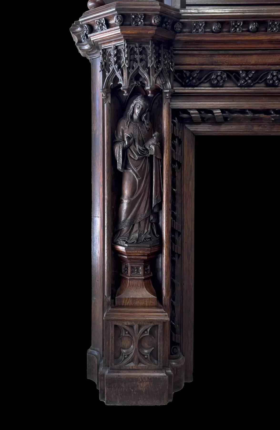 Carved A magnificent antique English 19th century Gothic Revival carved oak mantel For Sale