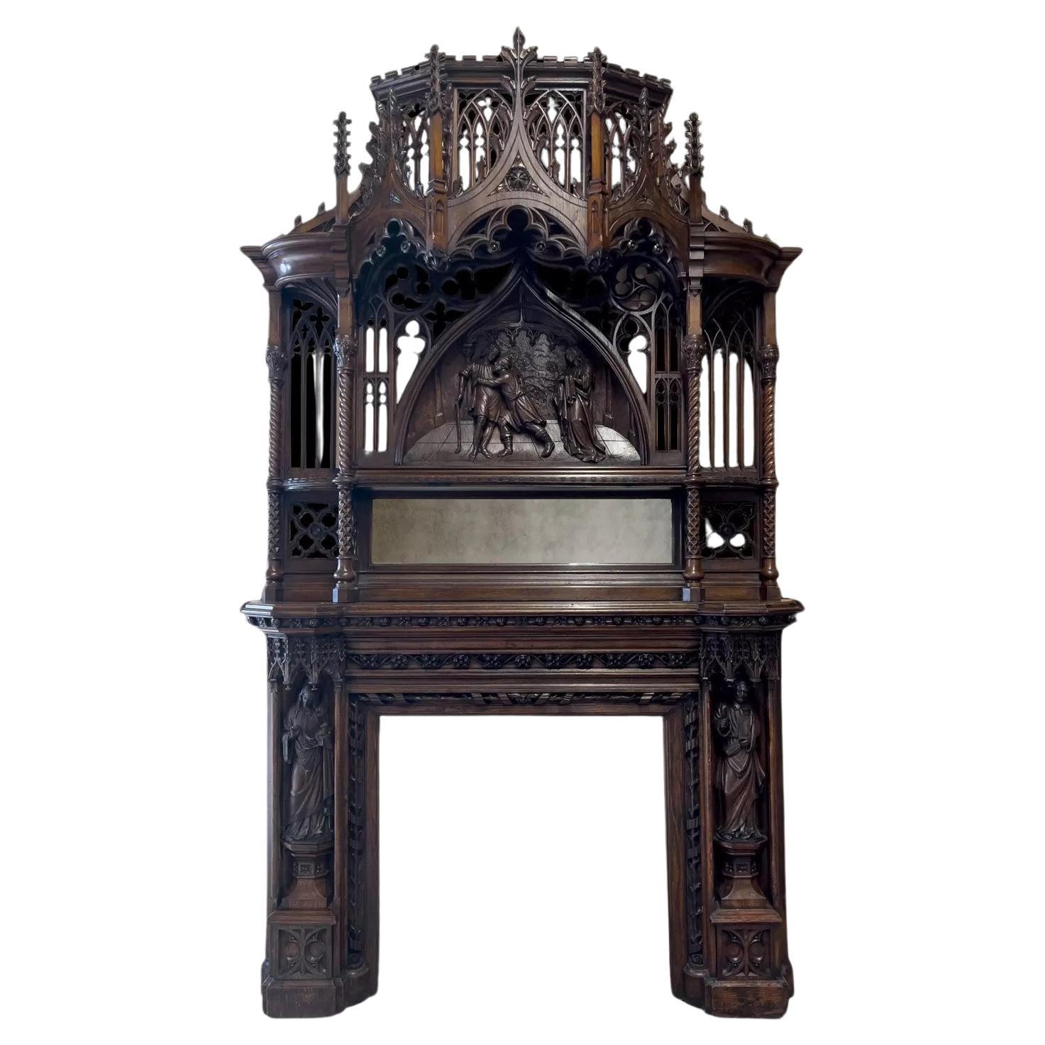 A magnificent antique English 19th century Gothic Revival carved oak mantel For Sale