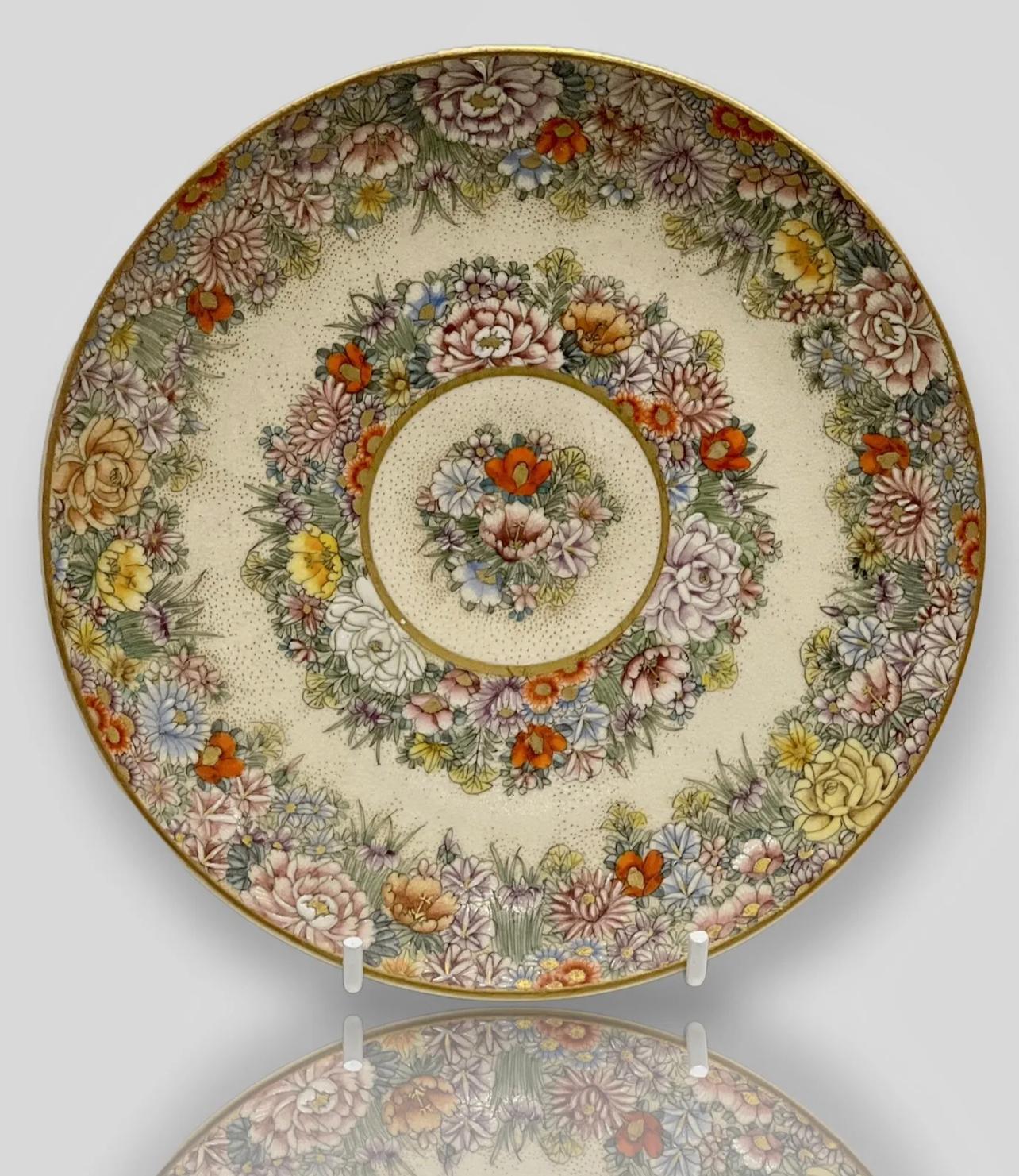 A Magnificent Satsuma Plate.
Late Meiji period, early 20th C. Signed. 

Very elegant Japanese satsuma plate hand painted with a magnificent floral decorations. The painting is a top quality and very detailed, some elements of the flowers are