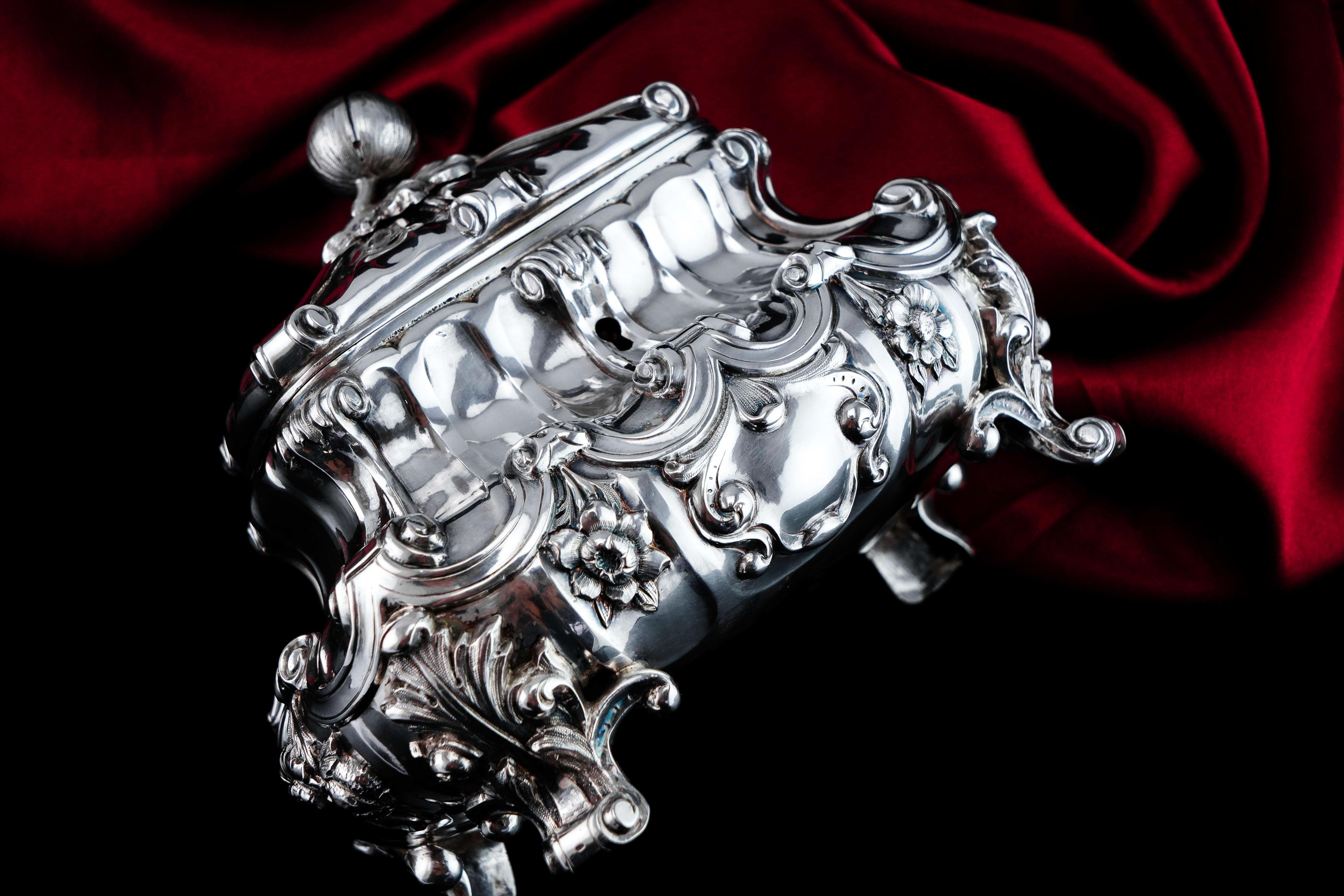 We are delighted to offer this magnificent solid silver tea caddy/sugar box made in the most ornate and profusely decorated fashion, likely of continental origin in the mid-19th century. 

The box is made from a fabulous gauge of silver with an
