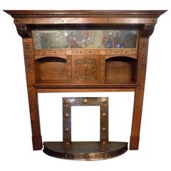 A magnificent Arts & Crafts Period oak fireplace probably by Edgar Wood