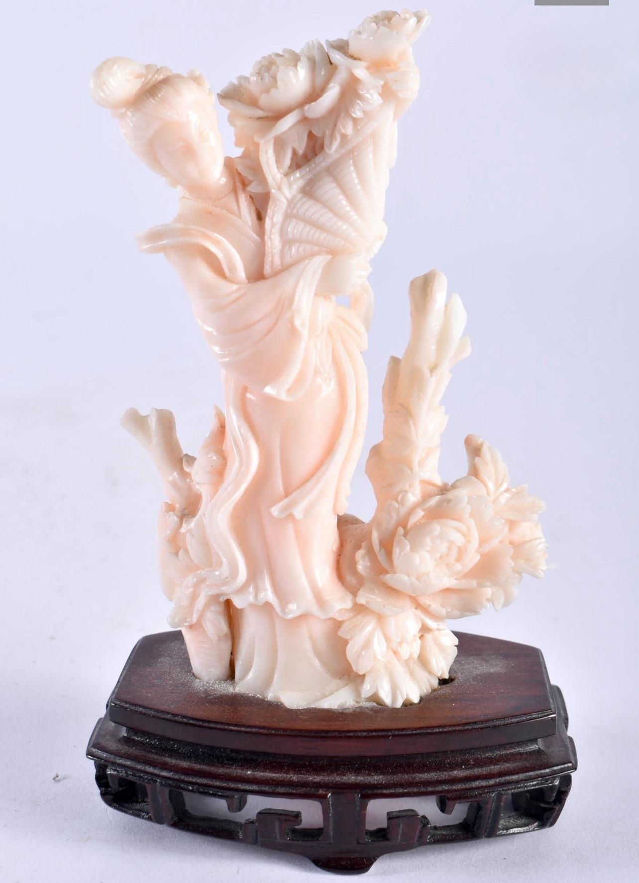 CHINESE HAND CARVED ANGEL SKIN NATURAL CORAL FIGURE OF A BEAUTY.
Late 19th C. Qing Dynasty.

Magnificently carved Chinese coral female beauty figurine standing surrounded with flowers and branches and holding a basket with flowers. 
Beauty is
