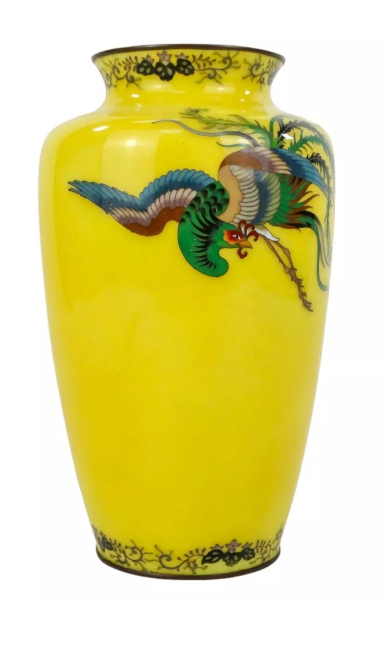 A Magnificent Japanese Cloisonné Enamel Vase by Ando Jubei

Taisho Era-Early 20th Century

Of elegant ovoid form with a short waisted neck and everted rim, worked in polychrome enamels and silver wire of the finest quality, the body decorated with a