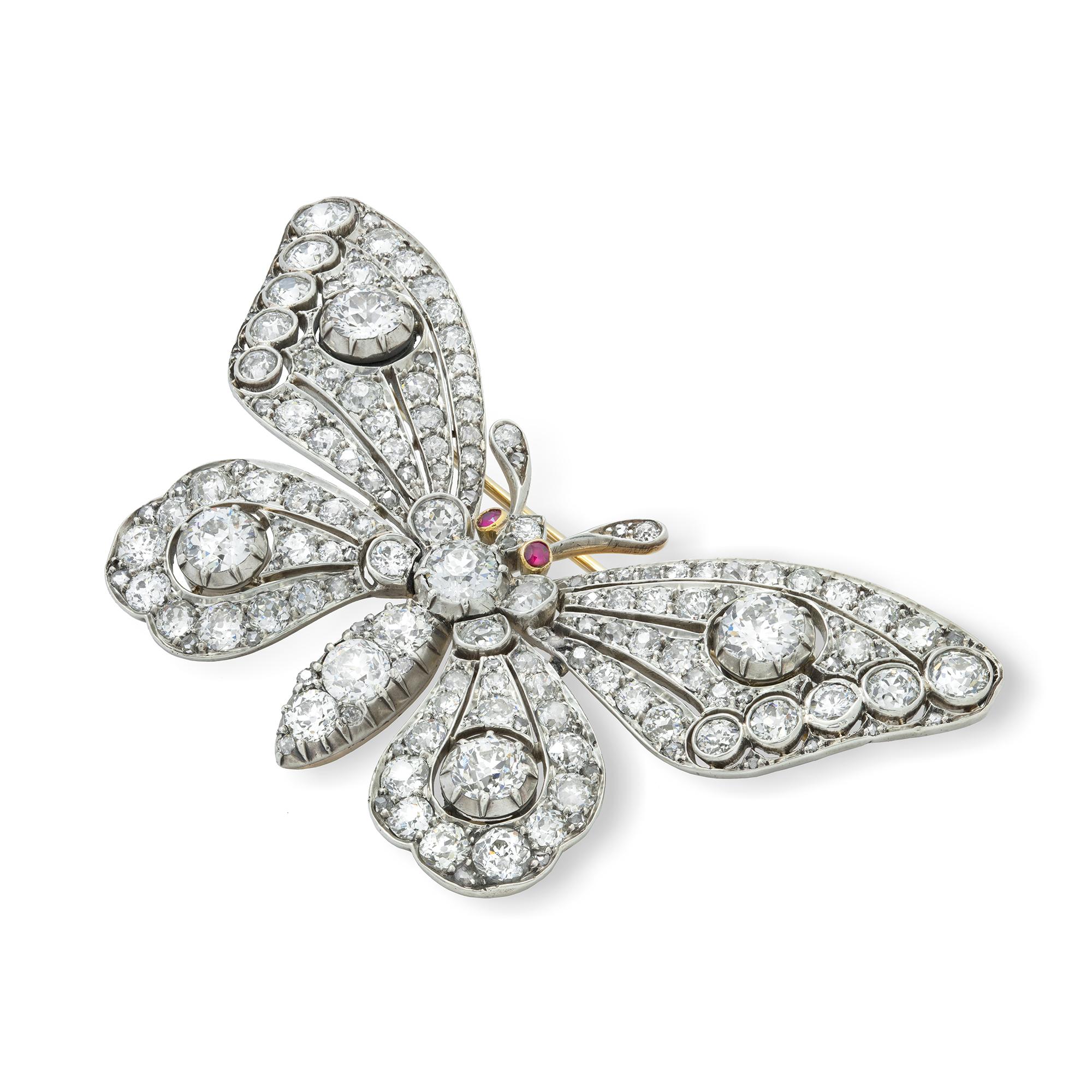 A Magnificent late Victorian diamond-set butterfly brooch, the brooch in the form of a butterfly, the body, pierced wings and head set throughout with old brilliant- and rose-cut diamonds, estimated to weigh a total of 15 carats, with ruby eyes, all