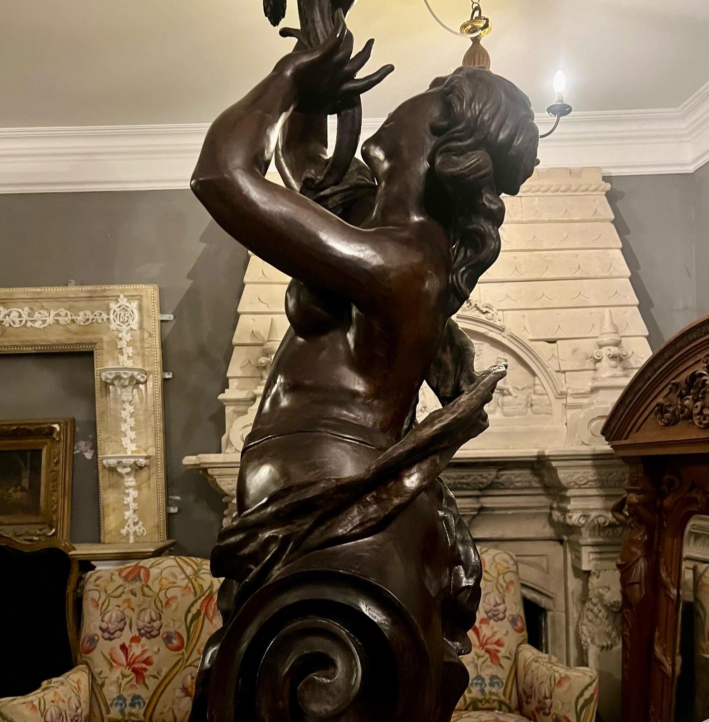 Beaux Arts A magnificent pair of free standing female figurative patinated bronze torchère  For Sale