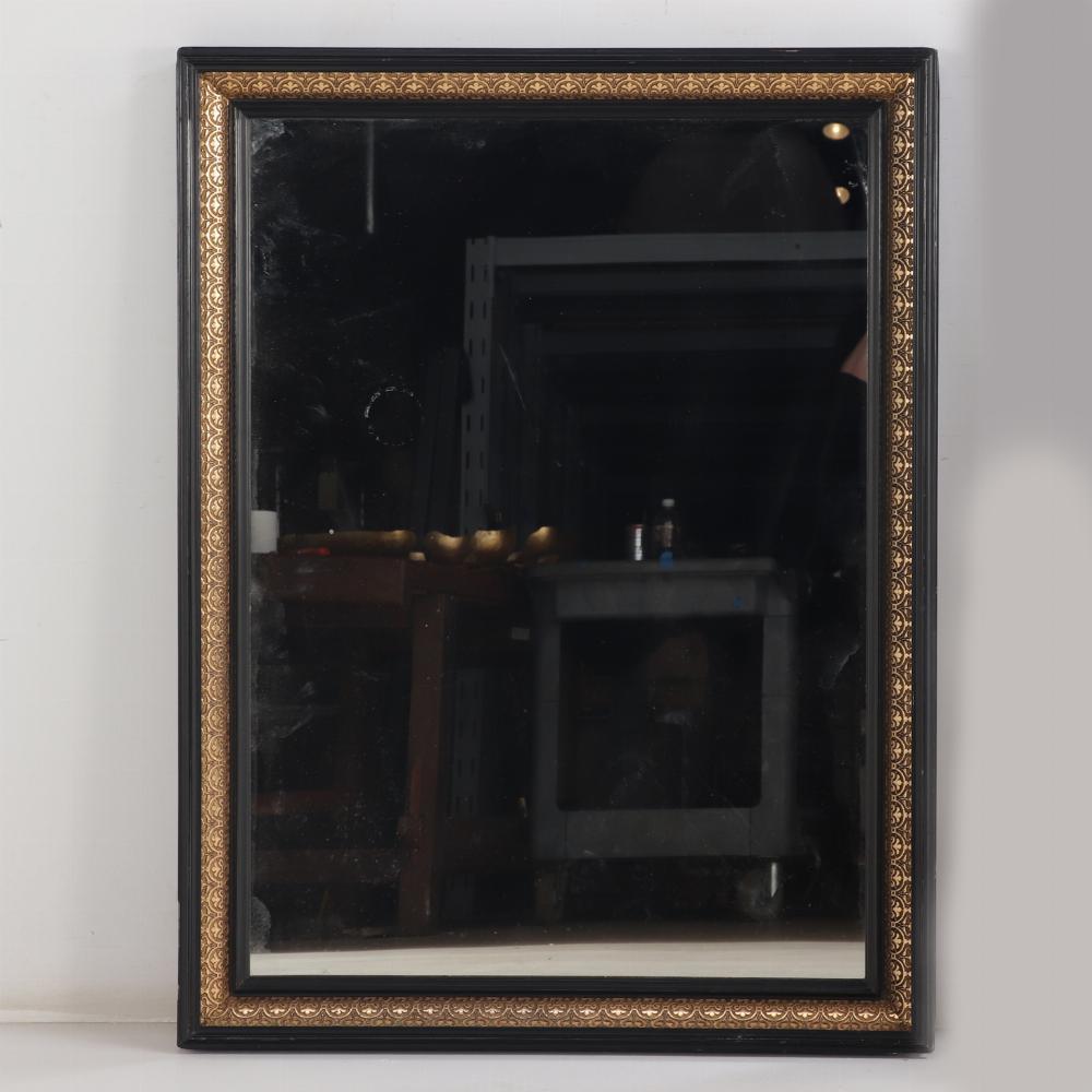 These mirrors have intricate gold gilt detailing on the black wooden frames. A perfect pair for dramatic look over a double vanity or dressing room! 

One bearing antique framer's label verso for 