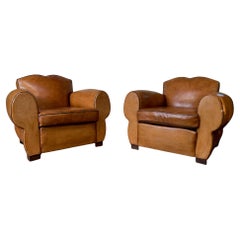 A Magnificent Pair of French Leather Club Chairs Caramel Moustache Models C1950