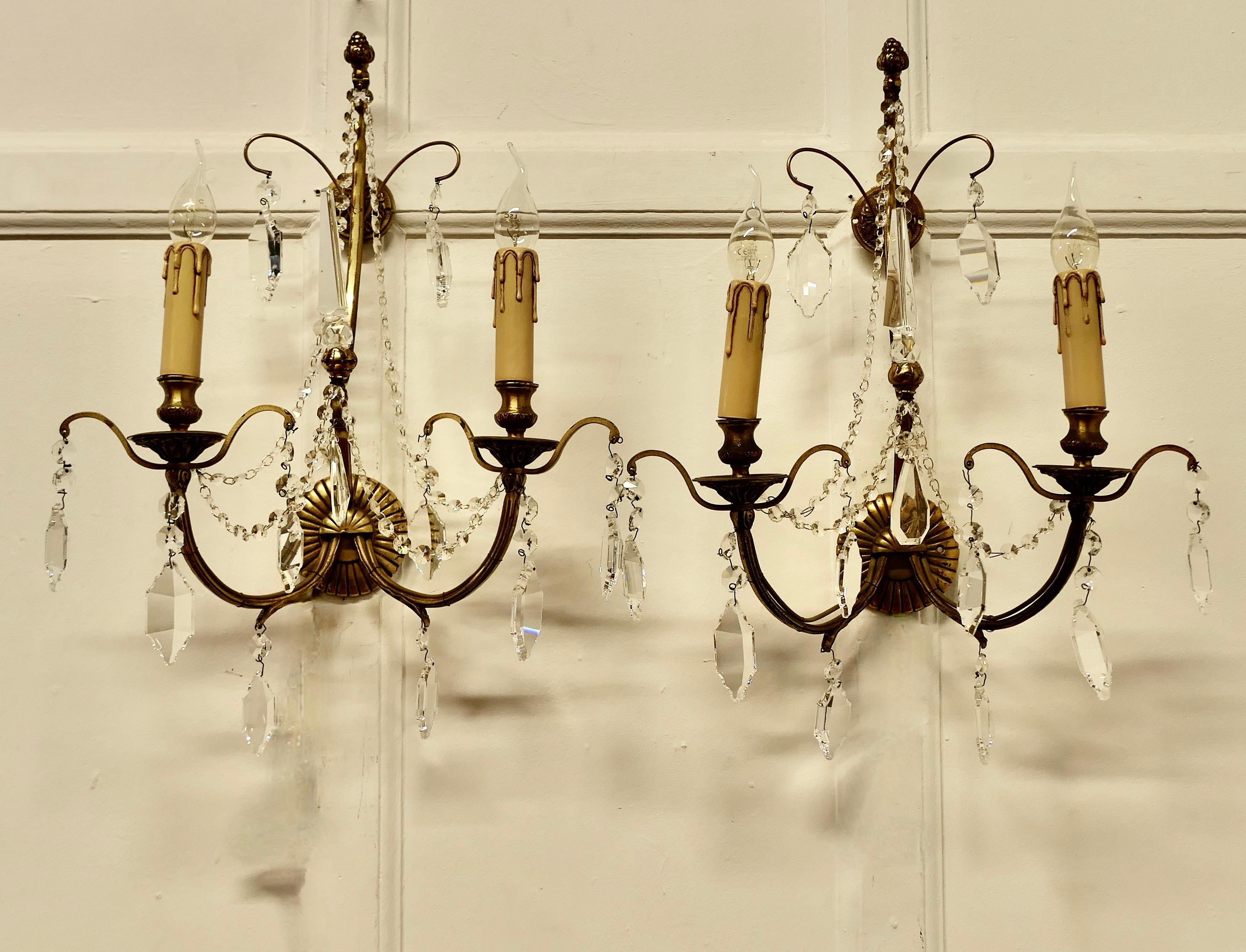 A Magnificent Pair of French Wall Chandeliers

This is a superb pair of twin sconce wall lights,  the lights are made in brass, curled into branches, they are hung with crystal pendants and chains

All creating a lovely sparkle when electrified with