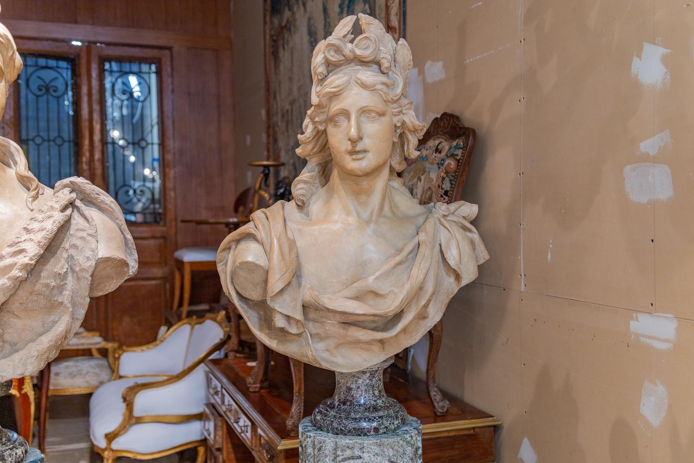 A large monumental pair of late 18th century Italian terra cotta busts of Apollo and Diana on jadeite and gilt bronze mounted pedestals. 77'' H overall on the pedestals. Busts are 37''H x 27''W x 13''D. Provenance Prominent Beverly hills estate.