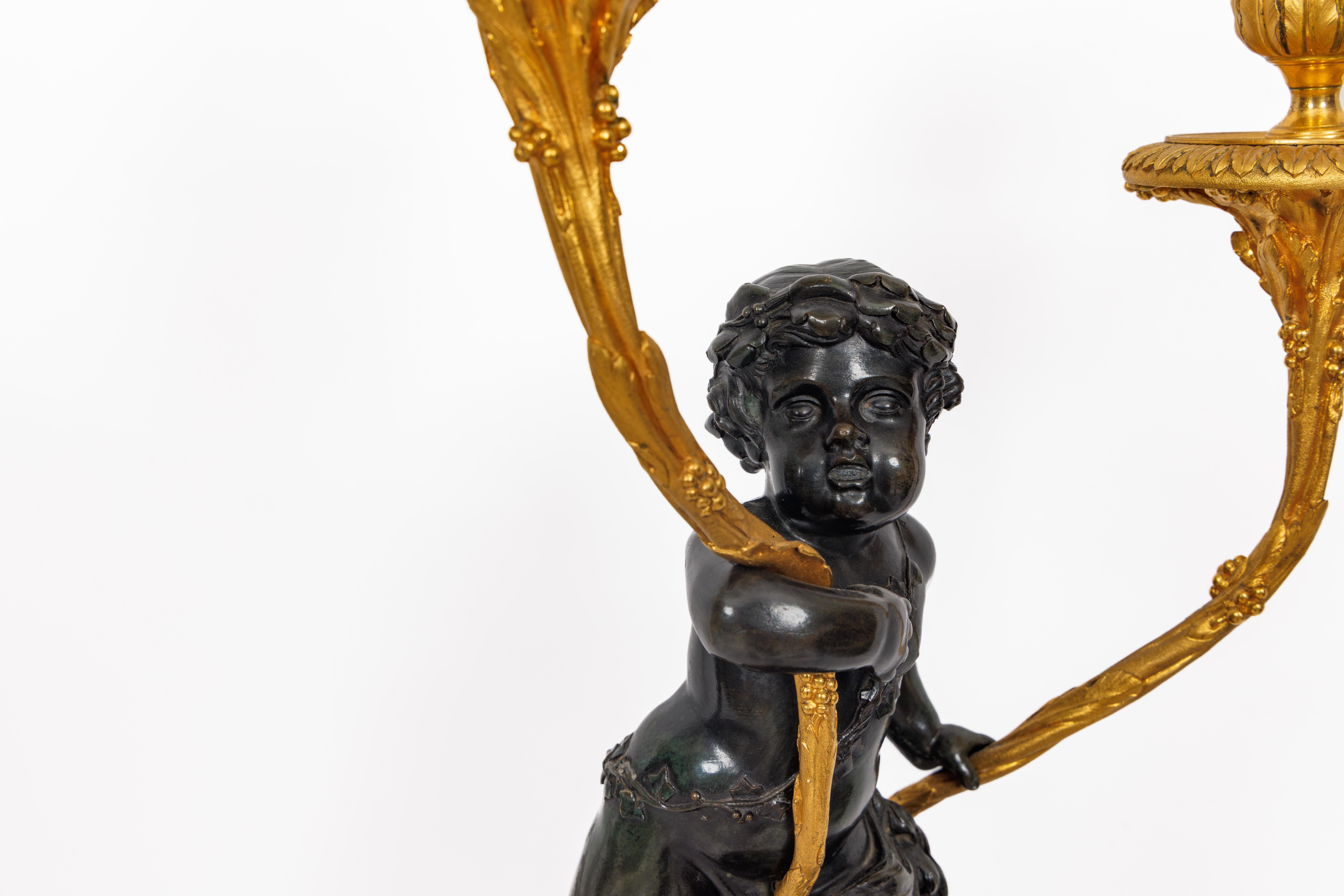 XIXe siècle Magnifique paire de candélabres en bronze doré de style Louis XVI sur bases en porphyre en vente