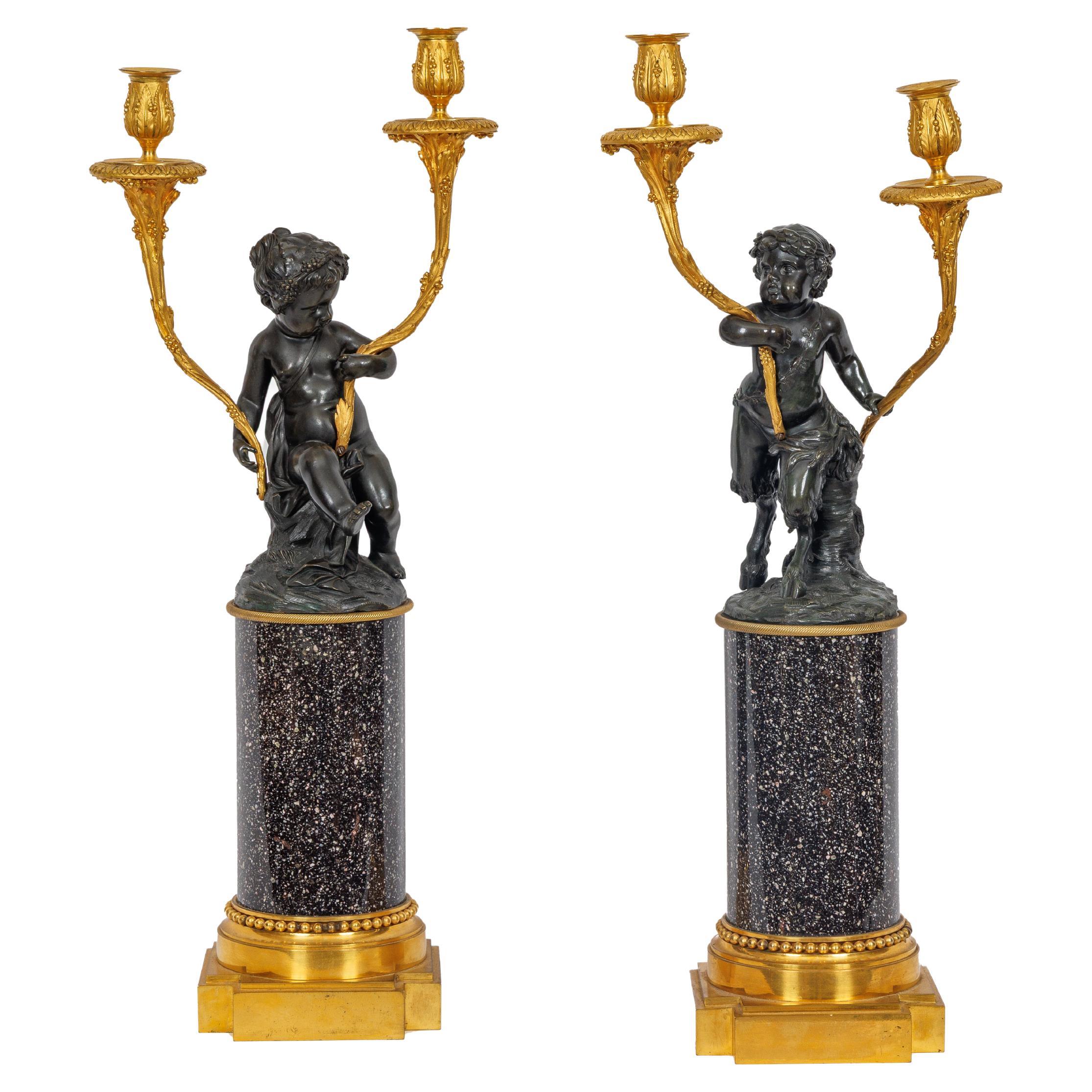 Magnifique paire de candélabres en bronze doré de style Louis XVI sur bases en porphyre