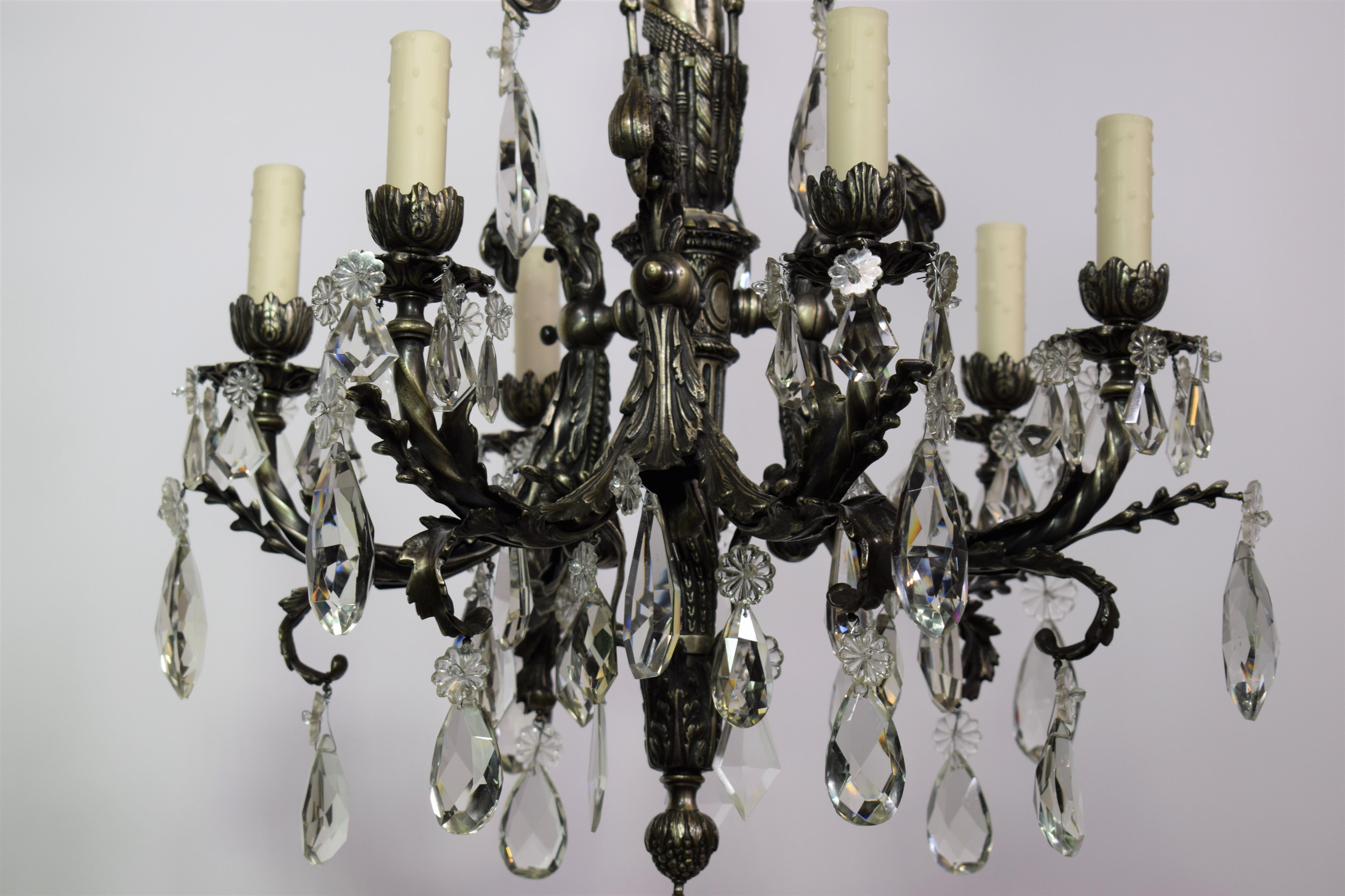 A magnificent silver over bronze and crystal chandelier featuring eagle's head. Great quality.  6-lights.  France, circa 1900
Dimensions:  Height 35