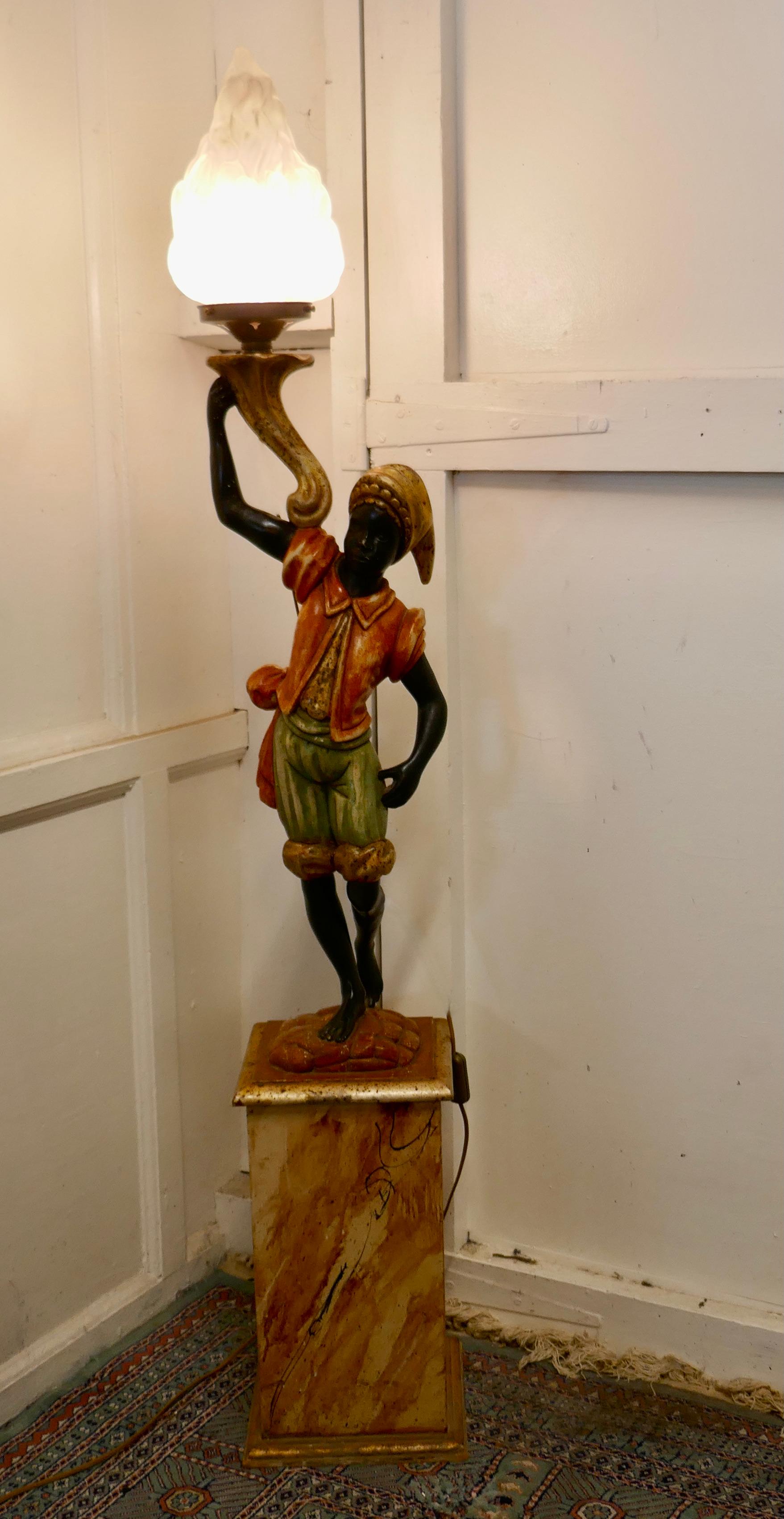 A magnificent venetian figural floor lamp

A charming Italian carved wooden figural floor lamp
The figure is carved in soft wood which has been prepared with gesso before being painted, the colours are good if a little worn by the years, he is