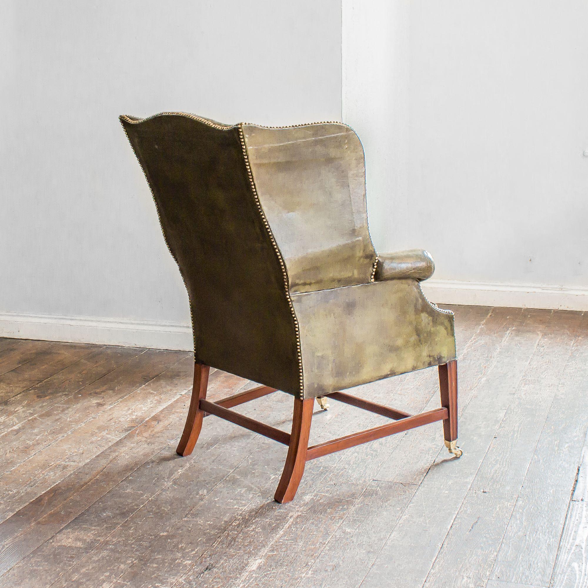 Edwardian Mahogany and Green Leather Wing Armchair For Sale