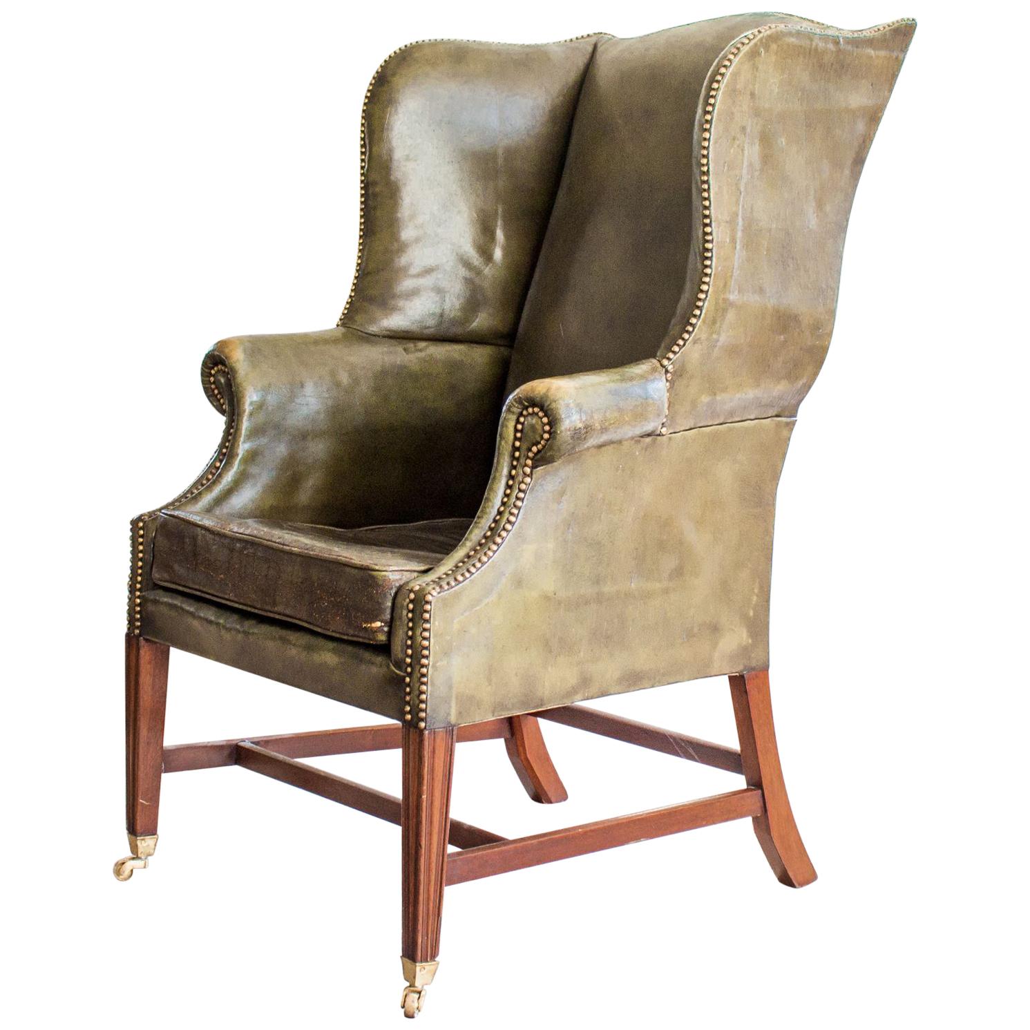 Mahogany and Green Leather Wing Armchair For Sale