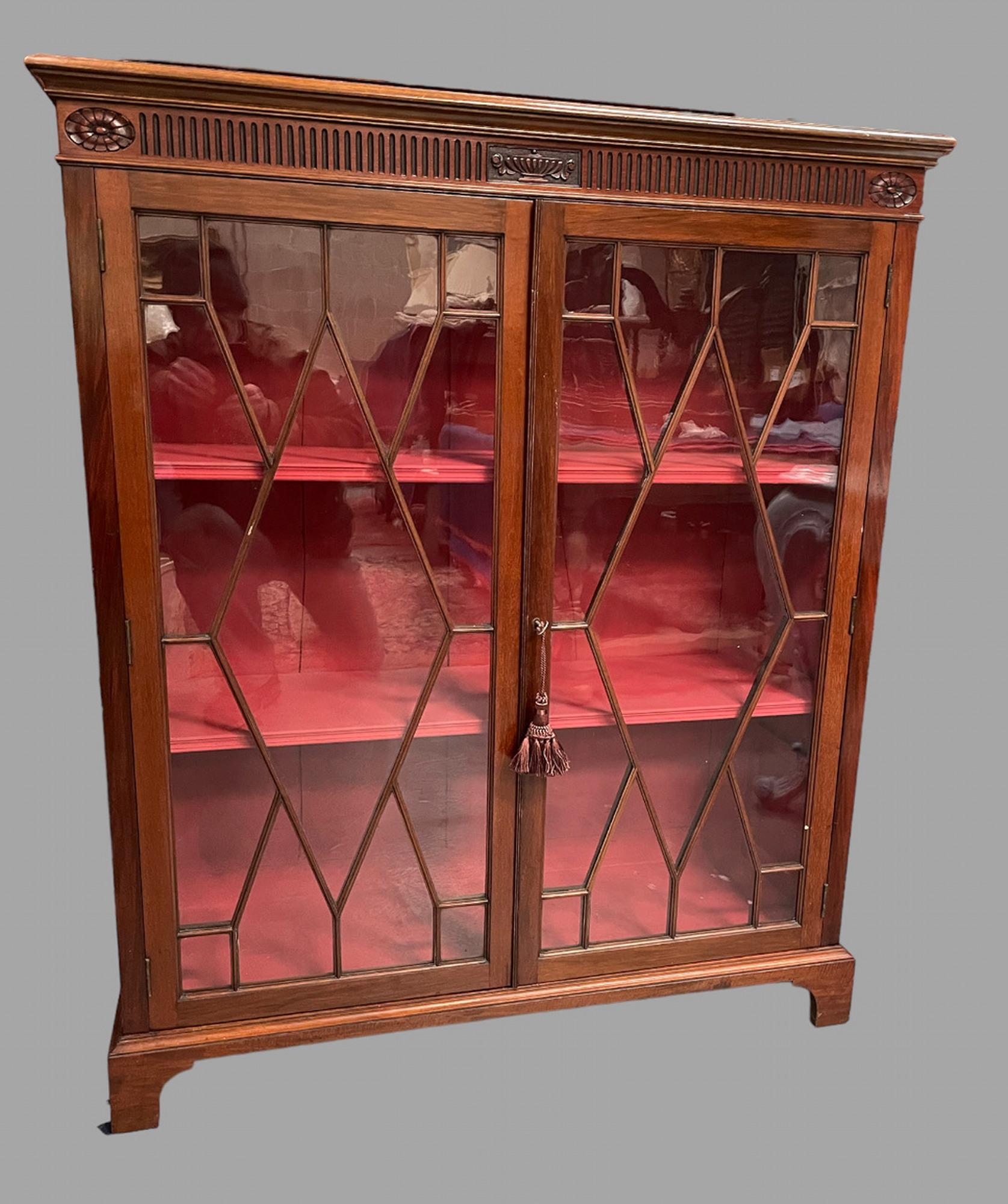 A mahogany Edwardian Bookcase with three shelves, which can be adjusted if needed and painted internally a Regency red.