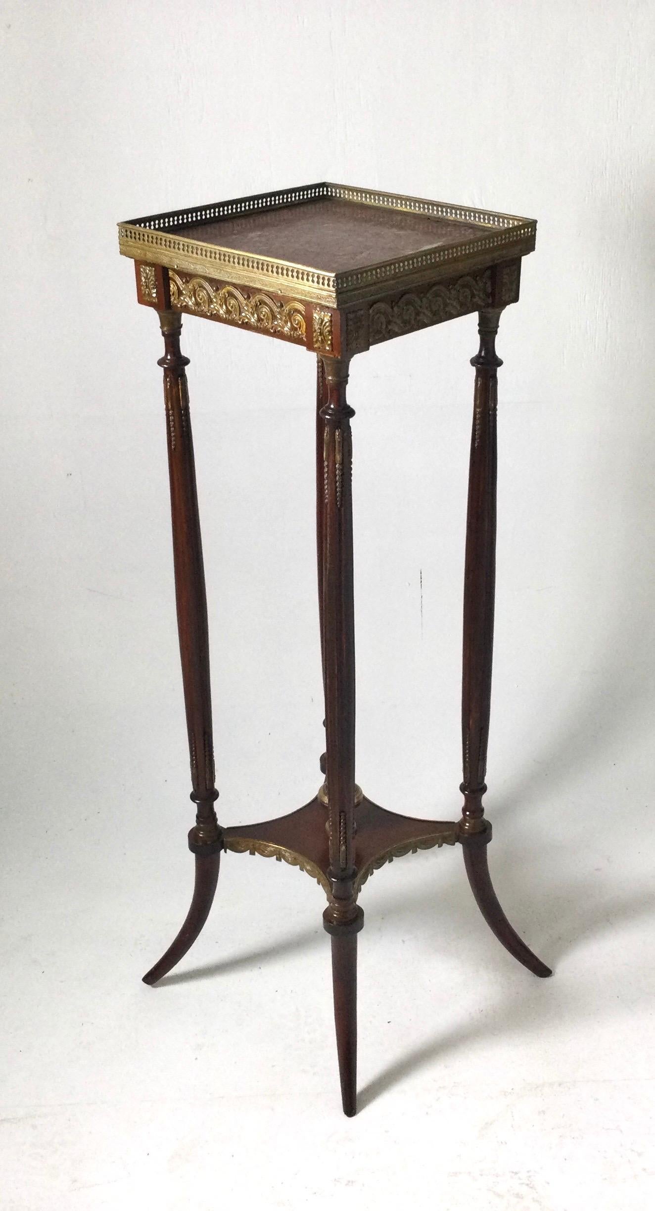 A square gallery edge marble top table stand with lower shelf. The bronze mounts along the apron, on the legs and gallery edge with violet marble top. 12 by 12 square at the top and 14 square at the base,