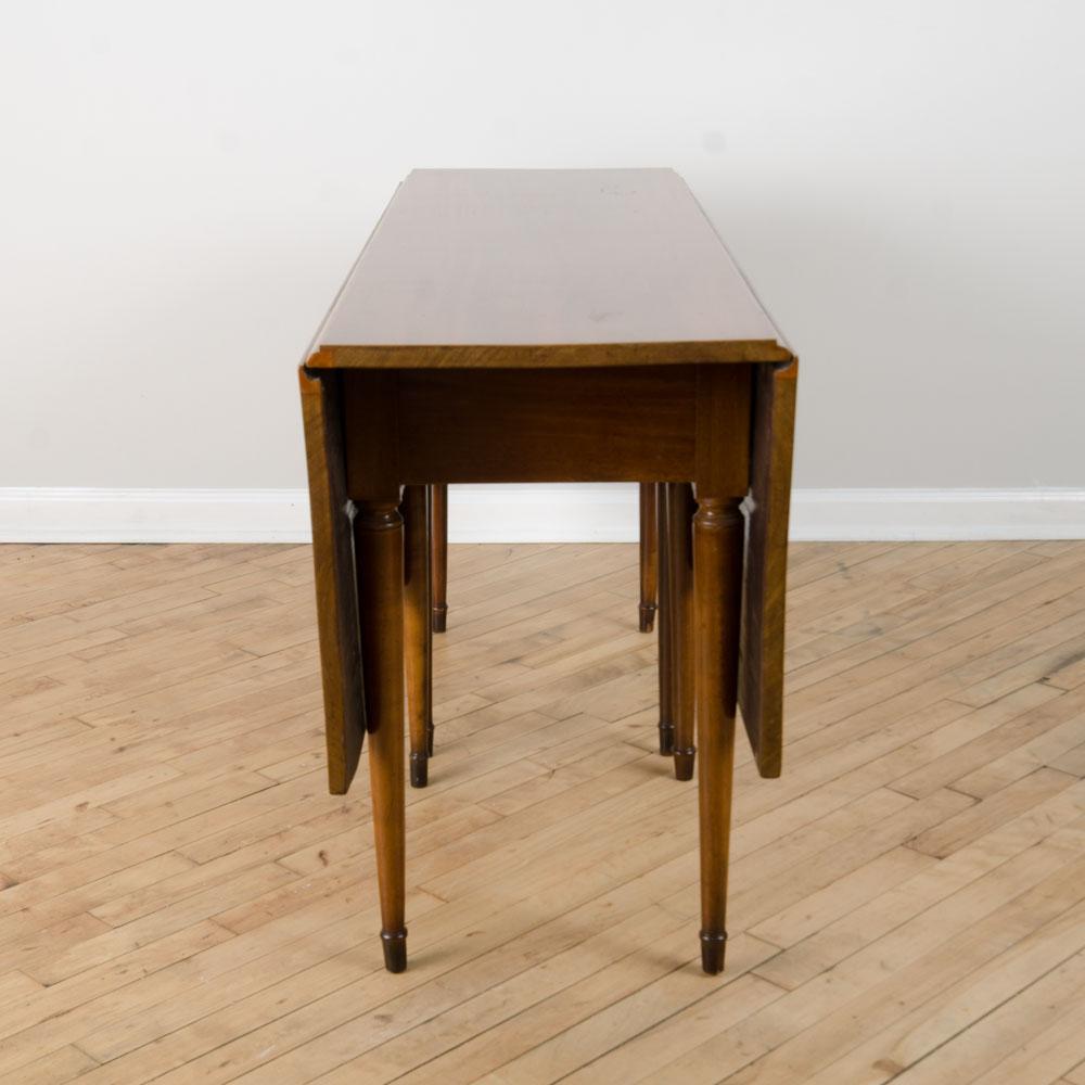 Mid-Century Modern A mahogany drop leaf table. 1950's For Sale