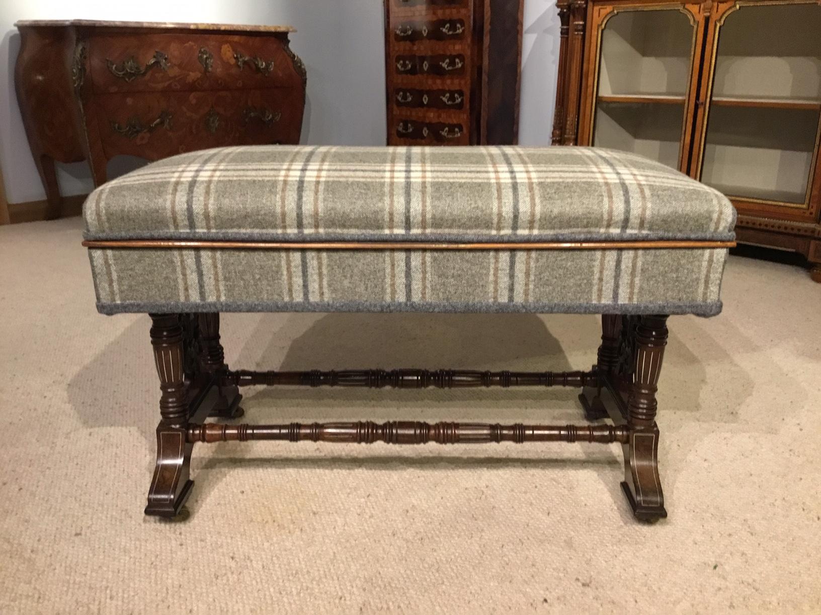 A mahogany inlaid Victorian period duet stool. A fine quality late Victorian duet stool upholstered in Abraham Moon wool and having a hinged seat revealing a mahogany lined storage area for sheet music, that can now be used for magazines etc.