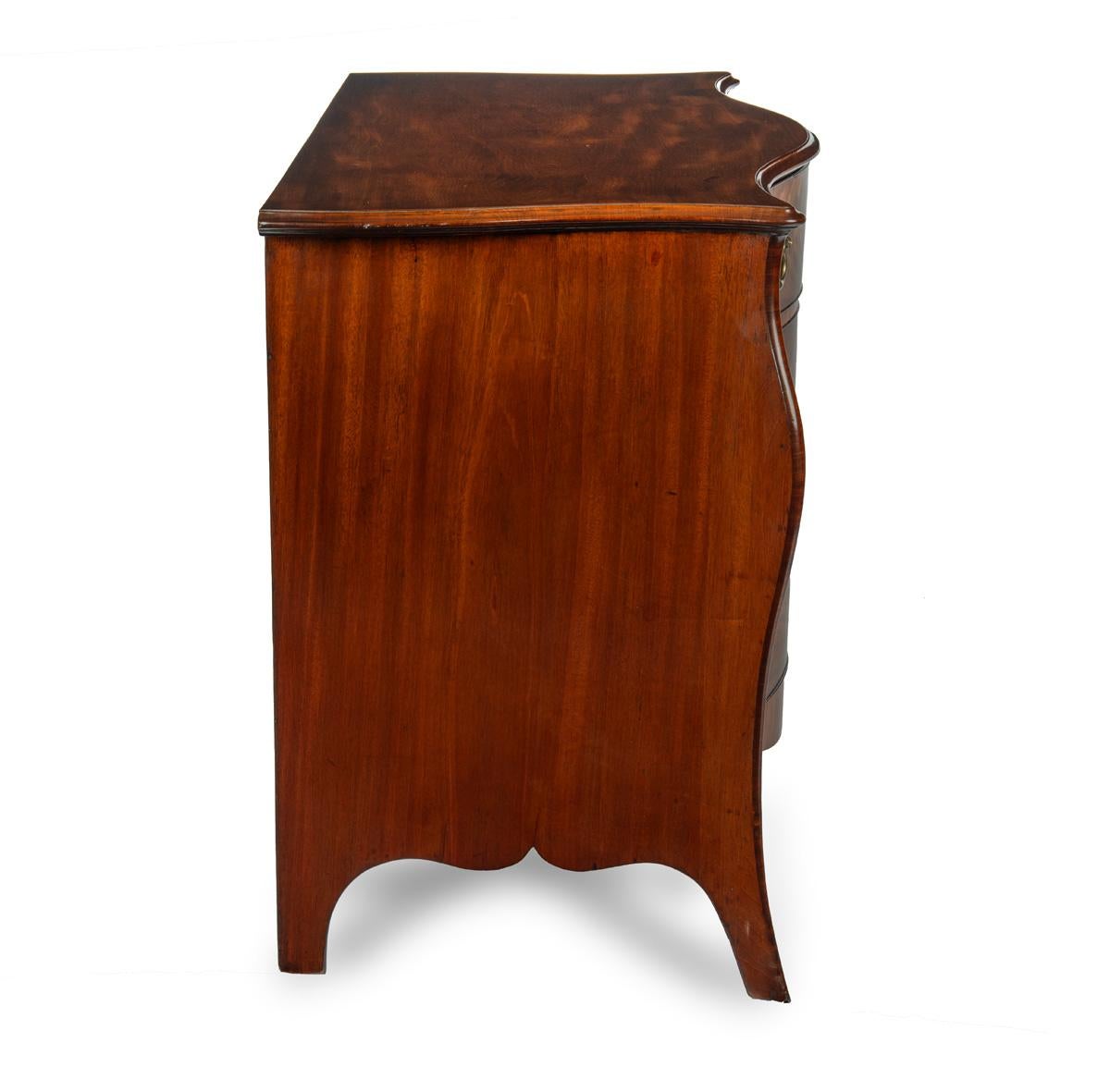 Late 18th Century A mahogany three-drawer serpentine chest of drawers, attributed to Henry Hill For Sale