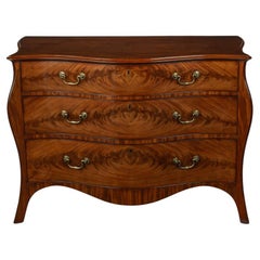 Antique A mahogany three-drawer serpentine chest of drawers, attributed to Henry Hill