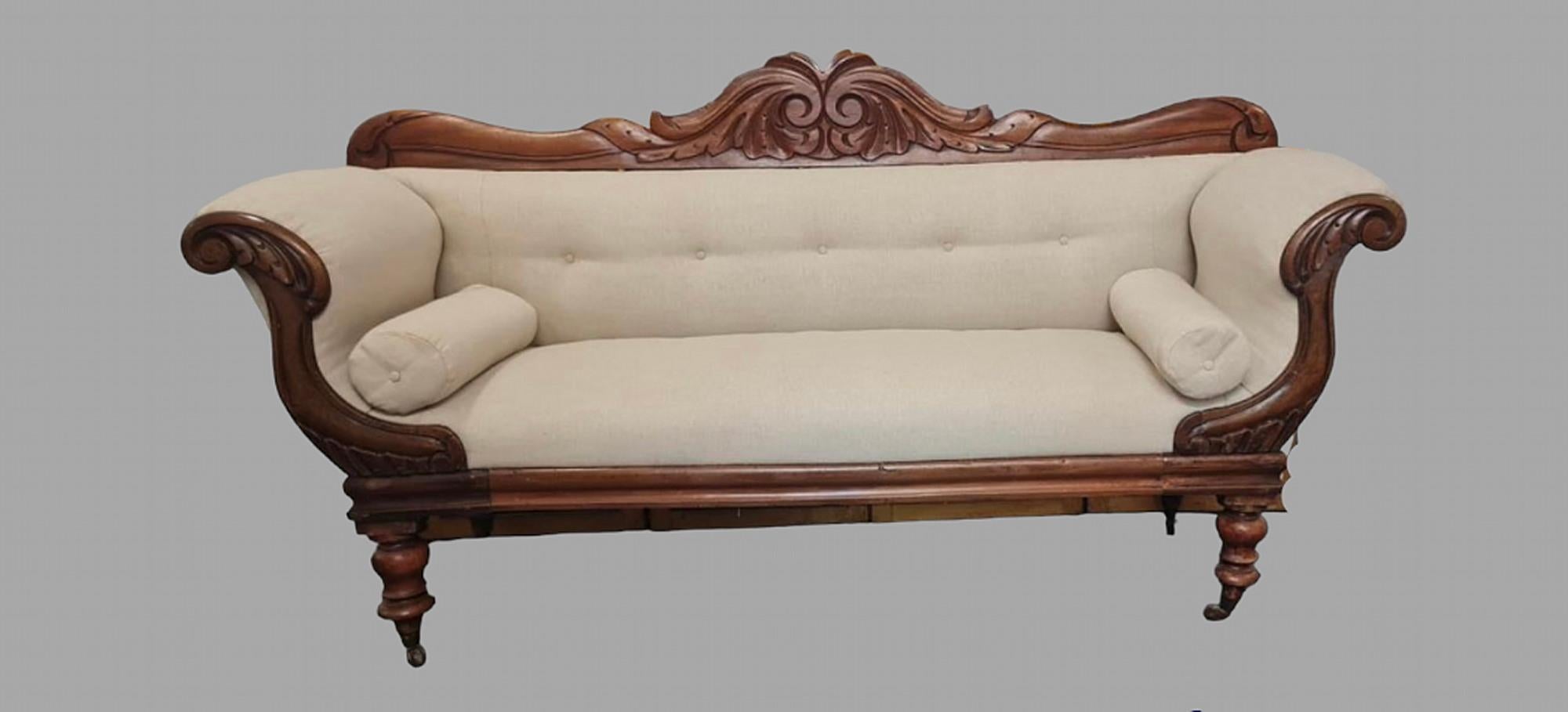 A Mahogany Victorian Show Framed Sofa with lovely buttoned back and scrolling arms. The upholstery recently done with a GP and J Baker neutral linen. Seat Height is 52 cm.