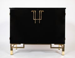 A Maison Jansen Black Lacquer Cabinet with Gilded Brass Accents