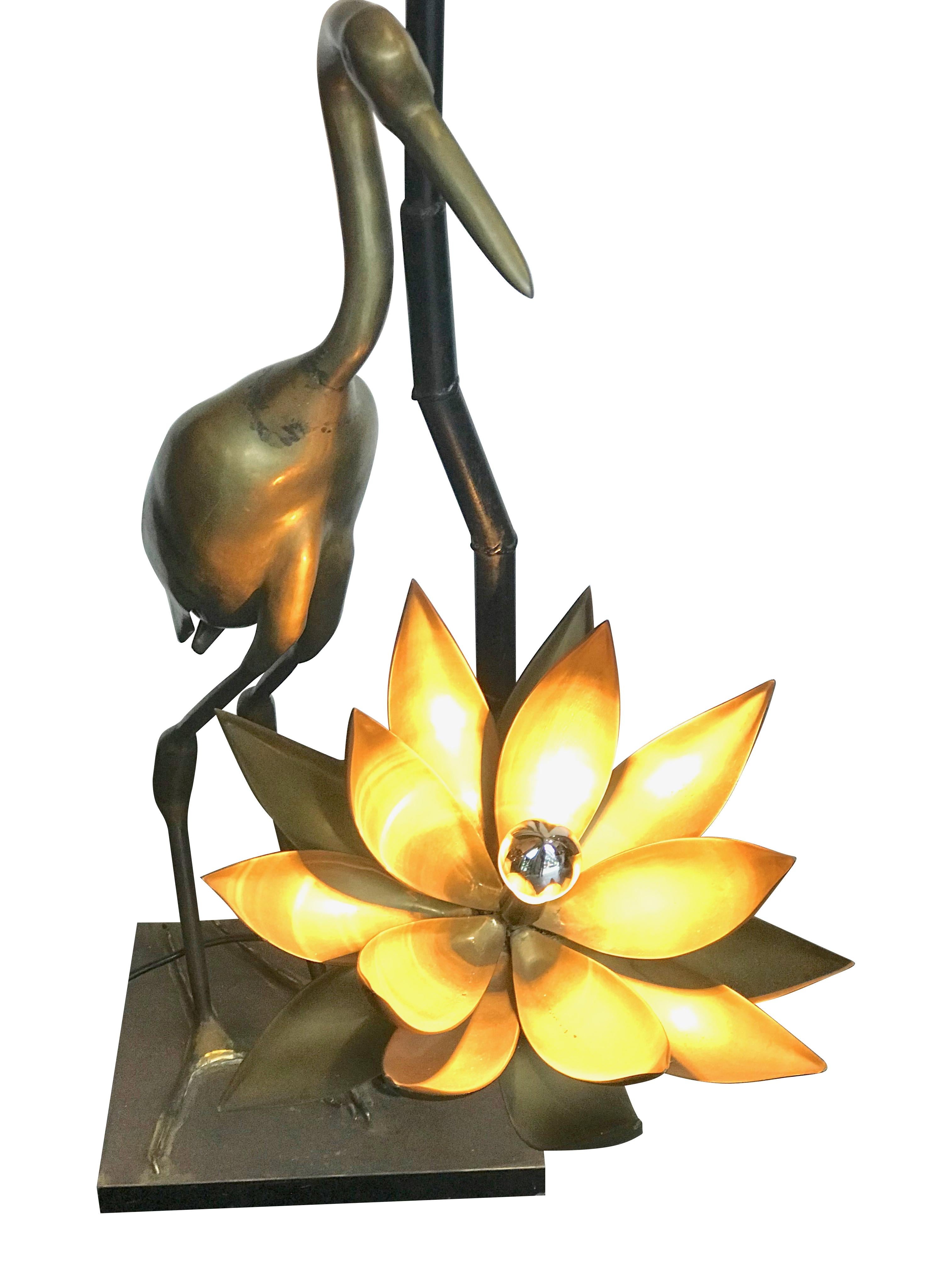 A stunning and original solid brass crane floor lamp, with two brass lotus flower lights, one part open on the top and the other fully open. Signed by Christian Techoueyres on the body of the crane 