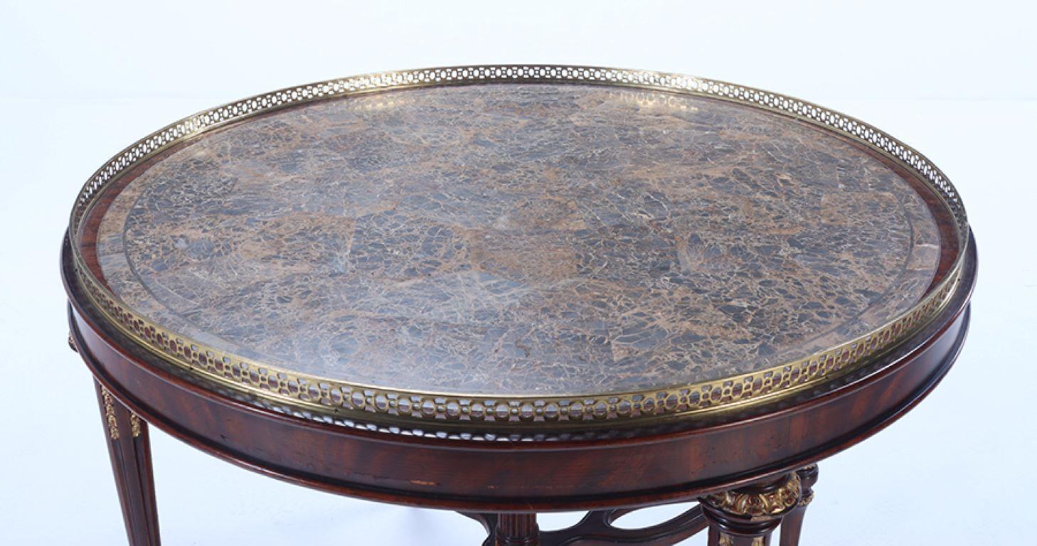 A Maitland smith crotch mahogany center table having a tessellated marble top For Sale 2