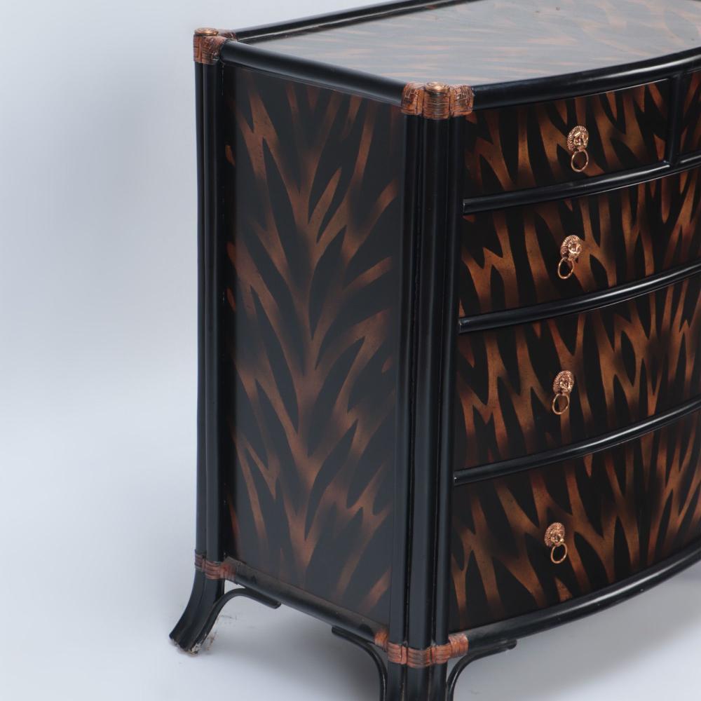 A  Maitland Smith ebonized five drawer bow front commode. In Good Condition For Sale In Philadelphia, PA