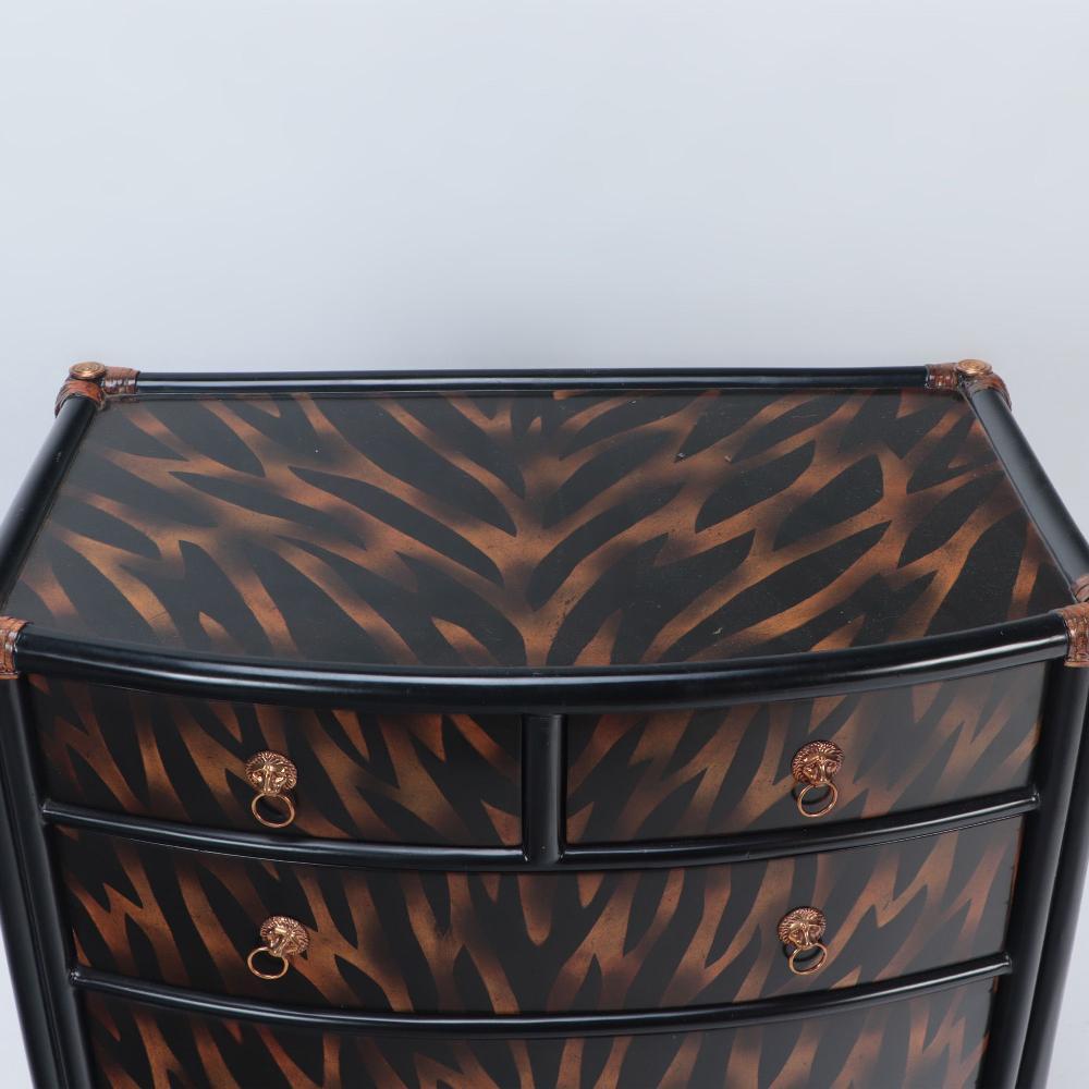 Late 20th Century A  Maitland Smith ebonized five drawer bow front commode.