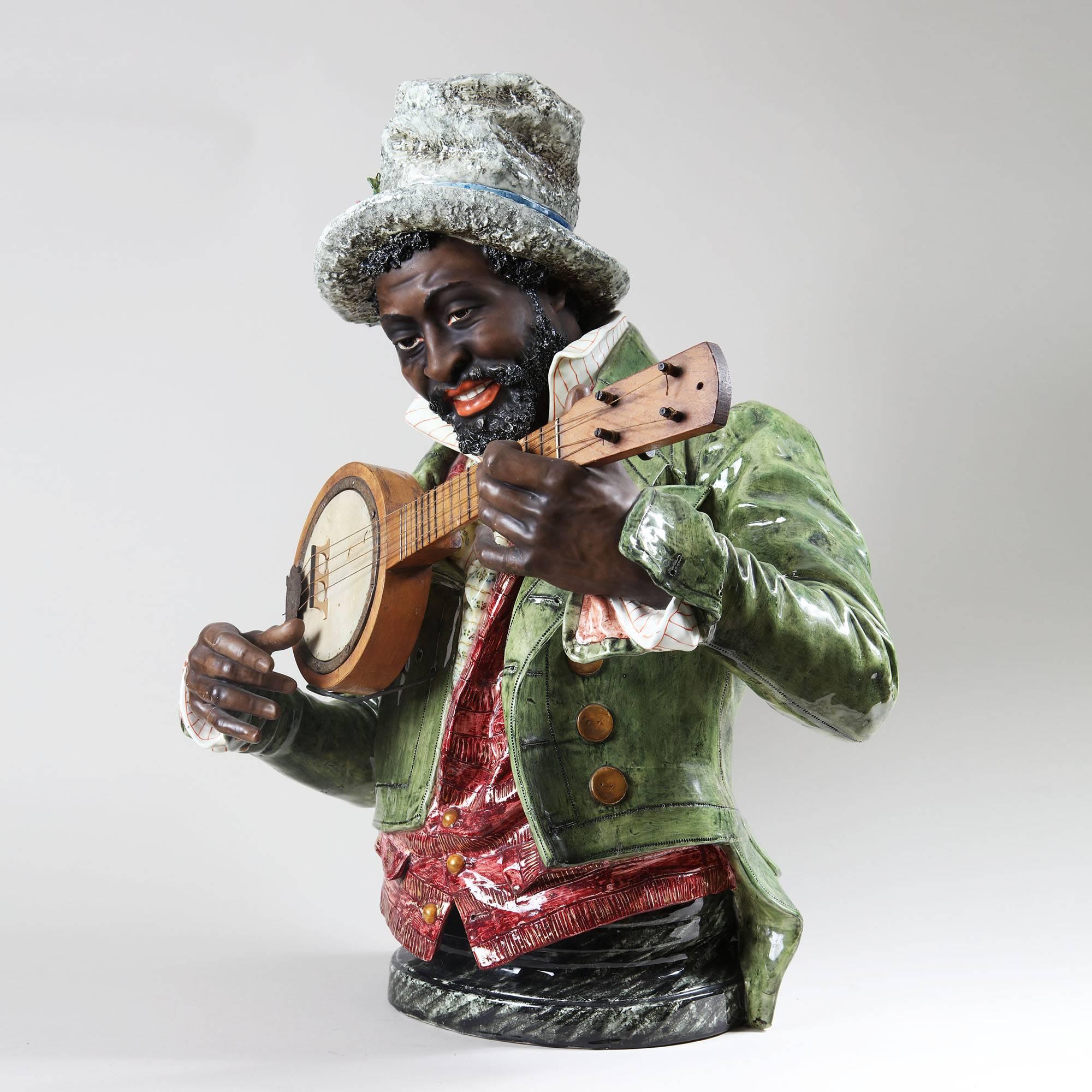 A Musical themed Majolica Man Playing the Banjo / Mandolin
Measures:
74 cm high, 
60 cm wide.
