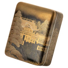A Maki-e Lacquer Tebako Box Embellished With Gold Decorations