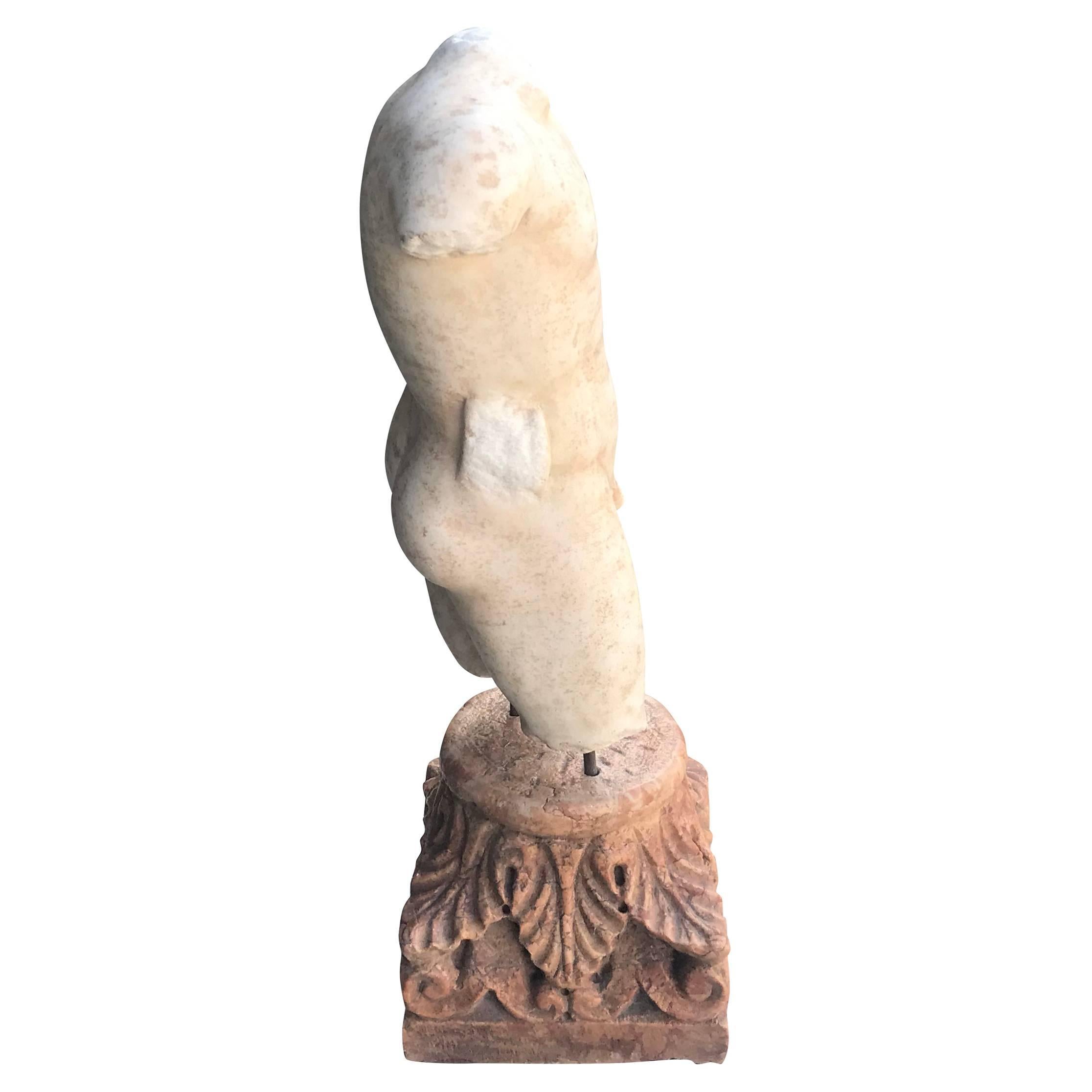 A vintage Italian male torso, hand carved in Thassos marble mounted onto a square Rosso Verona marble base adorned with acanthus leaves, in good condition. Wear consistent with age and use, circa 1860-1890, Sicily, Italy.