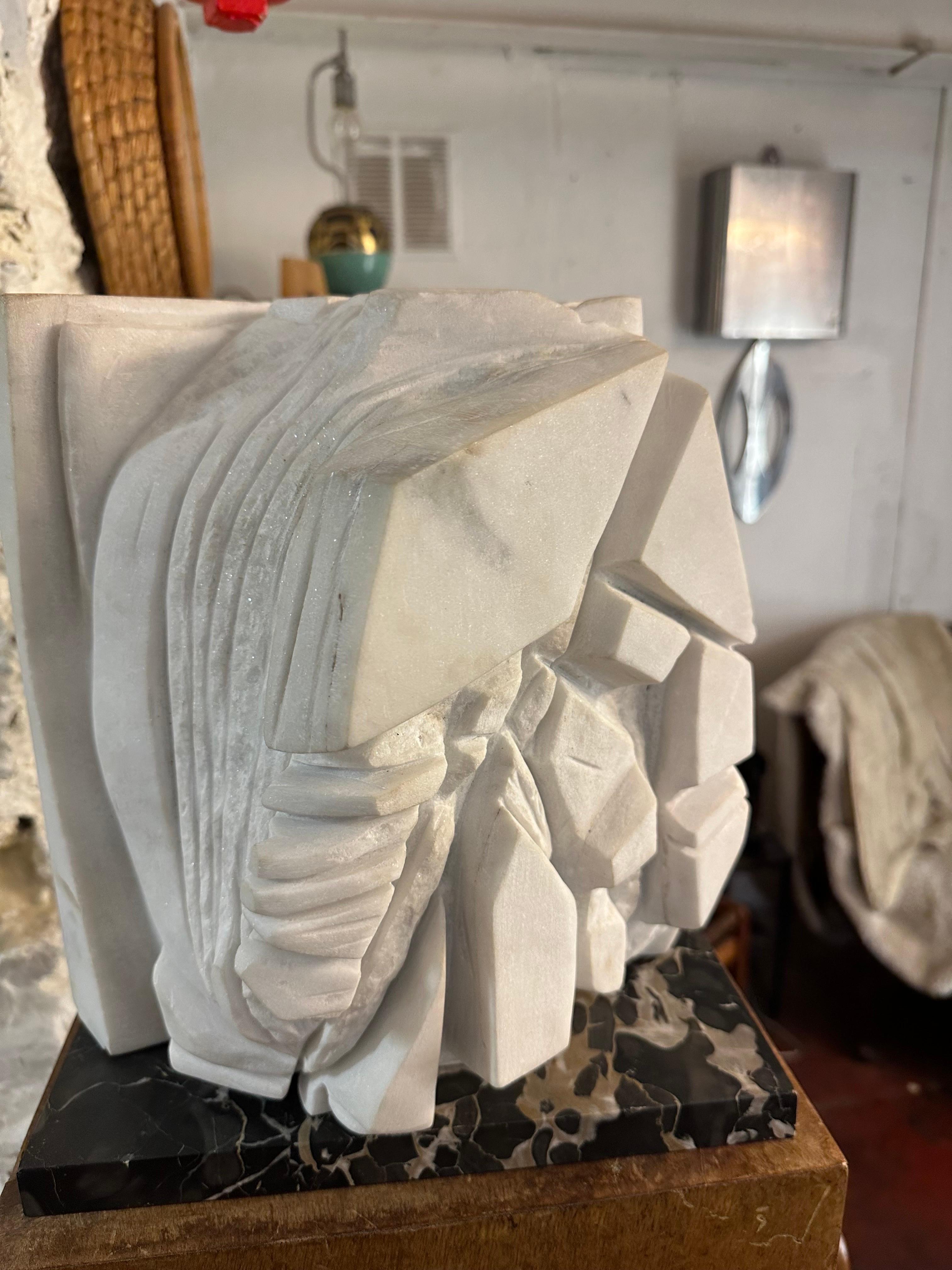 A marble abstract sculpture signed initial S T.