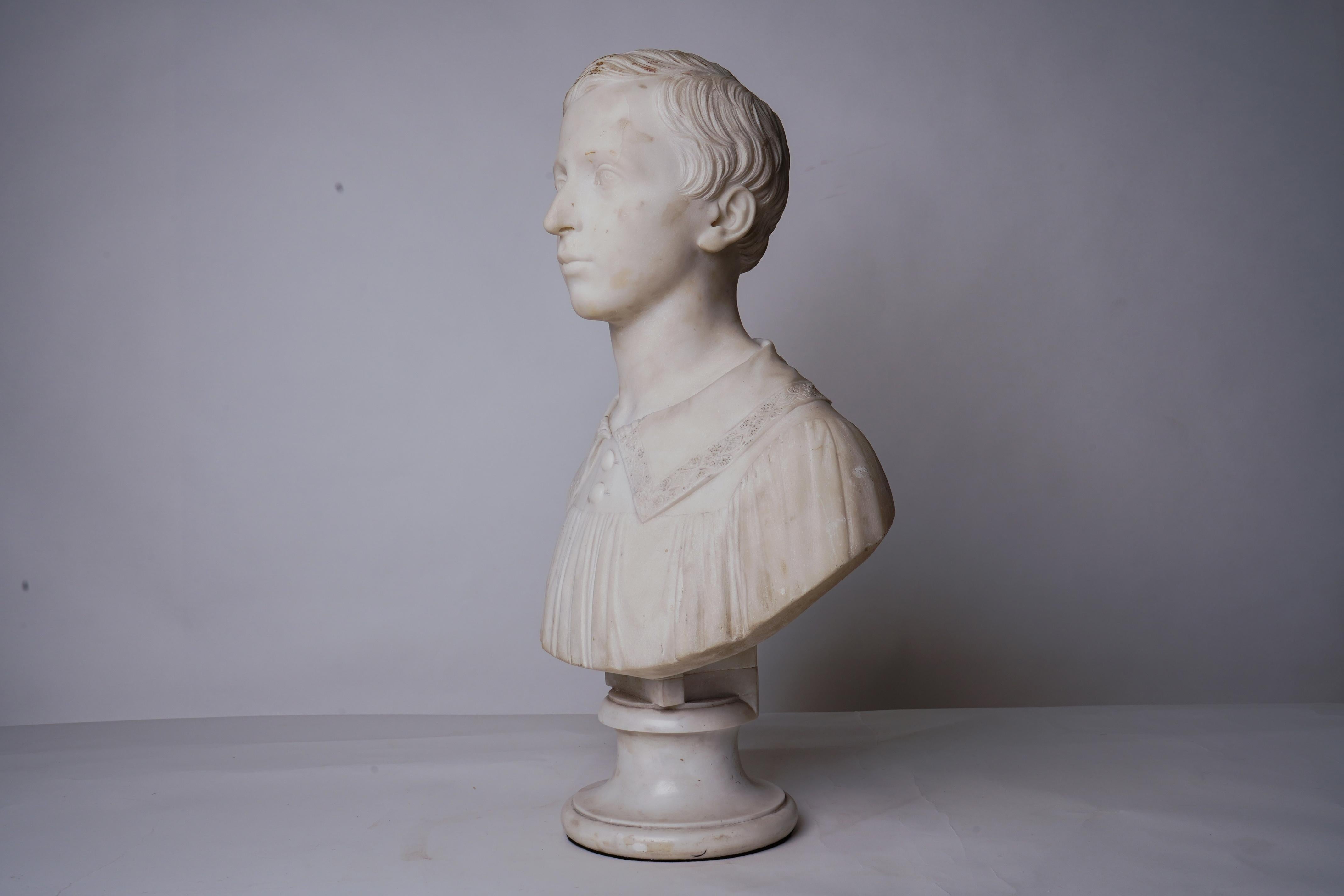 This bust depicts an adolescent, possibly at confirmation. The face is aristocratic and well-formed and damage is very limited. Although the marble does not appear to have been recently cleaned, it is relatively free of stains or discoloration.