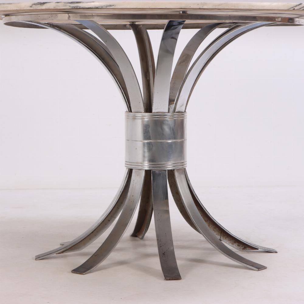 The white marble top with gray/black veining atop a base with 8 flat curved legs with central band drawing them all together. Perfect as a small dining table or as a center table. 