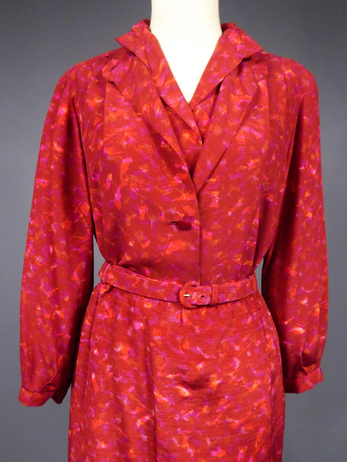 Circa 1975/1980

France

Three-piece set, blouse skirt and red printed silk jacket by Marc Bohan for Christian Dior Haute Couture numbered 06567 Circa 1975/1980. Probably a fashion show model in bolduc Adrienne. Sleeveless blouse and Mao collar