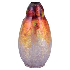A. Marty pour Limoges, France. Vase en métal avec décor émaillé