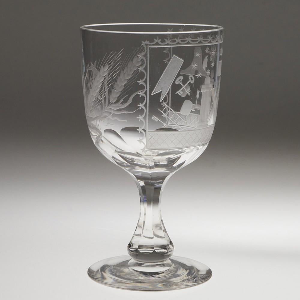 Heading : A masonic wihne goblet
Date : c1880
Period : Victoria
Origin : England, possibly Manchester
Colour : Clear
Bowl : Round funnel with petal cut lower bowl. Monogram CH set between ears of barley
Stem : Slice cut octagonal with baluster