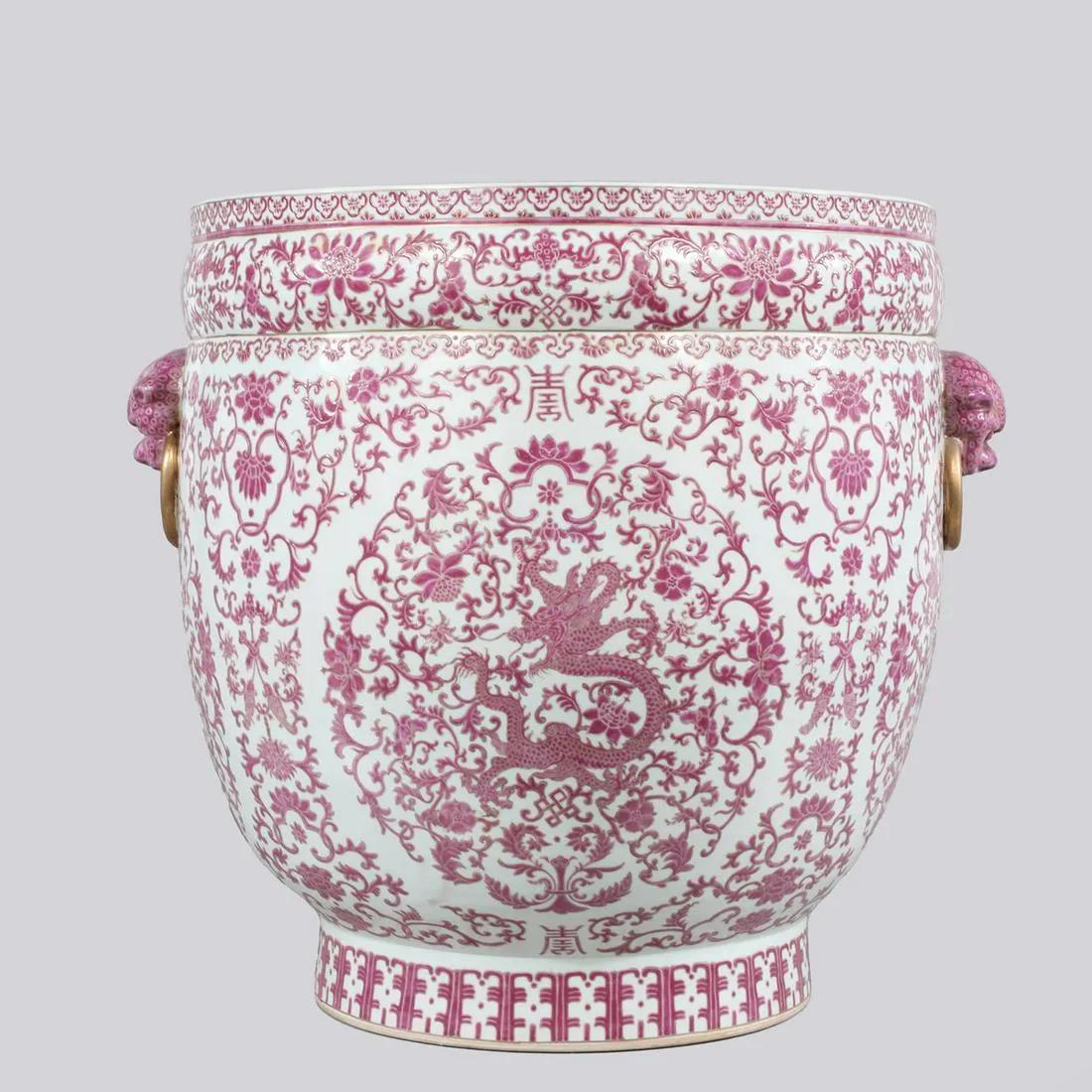 A Massive Pair of Chinese Pink and White Dragon Porcelain Planters, Republic Period.

Elevate your living space with a touch of timeless elegance with this exquisite pair of massive Chinese porcelain planters. Imbued with rich cultural symbolism and