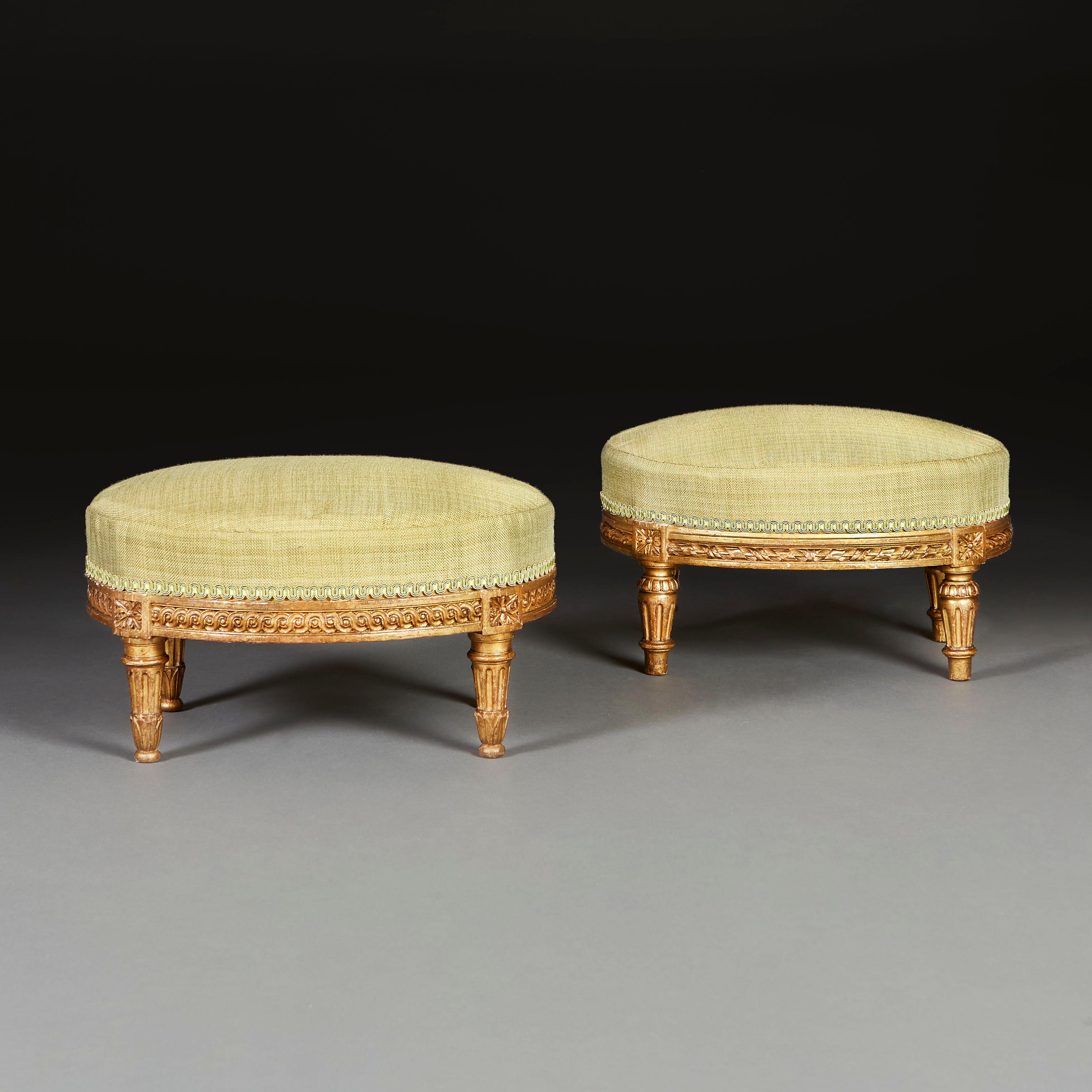 Carved Matched Pair of 18th Century French Giltwood Footstools For Sale