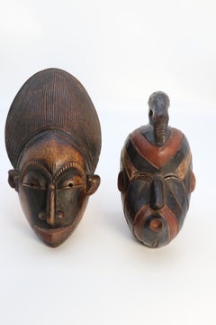 A matched pair of African tribal dance face masks, circa 1920