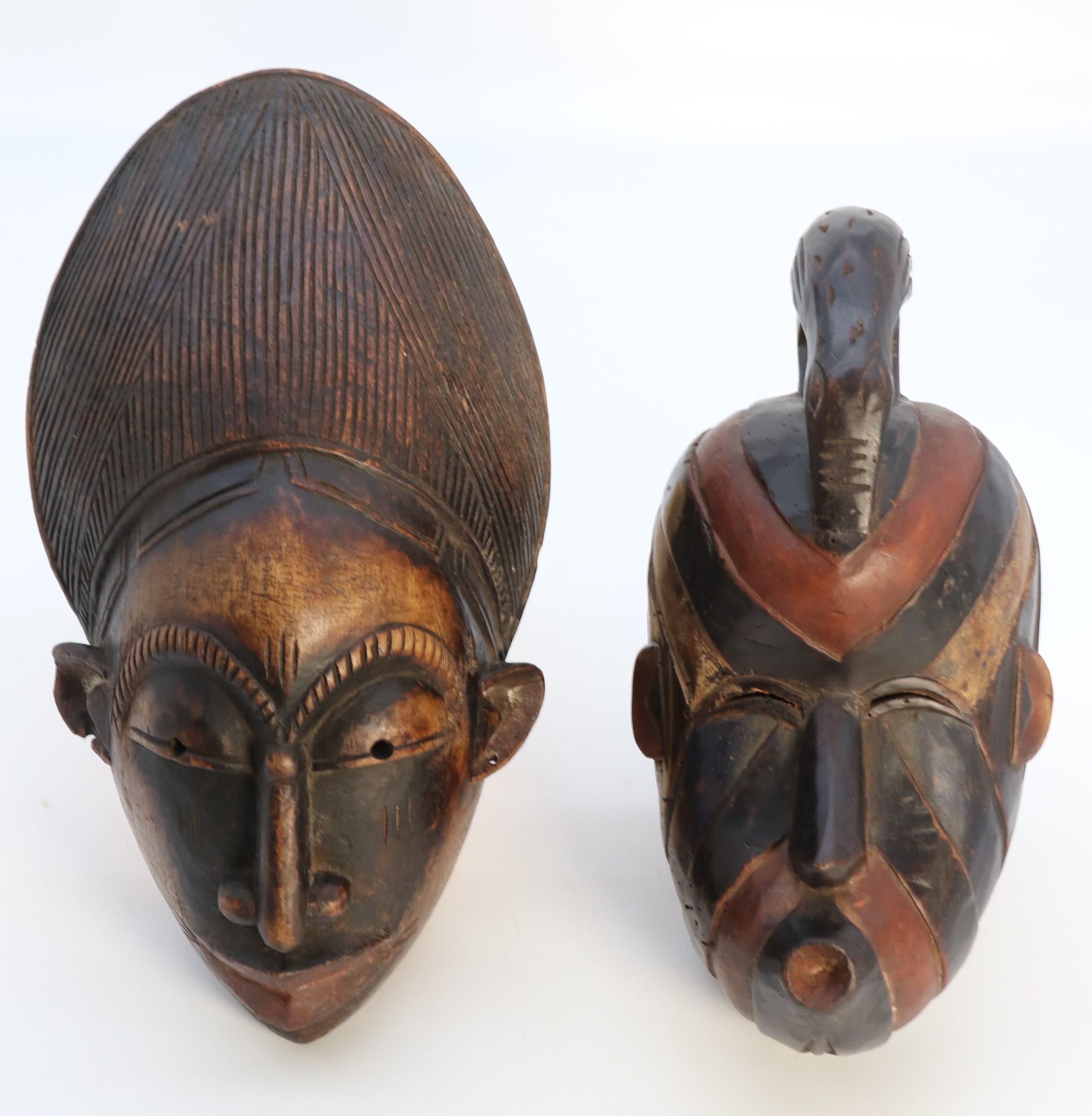 Hand-Carved A matched pair of African tribal dance face masks, circa 1920