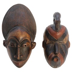 Antique A matched pair of African tribal dance face masks, circa 1920