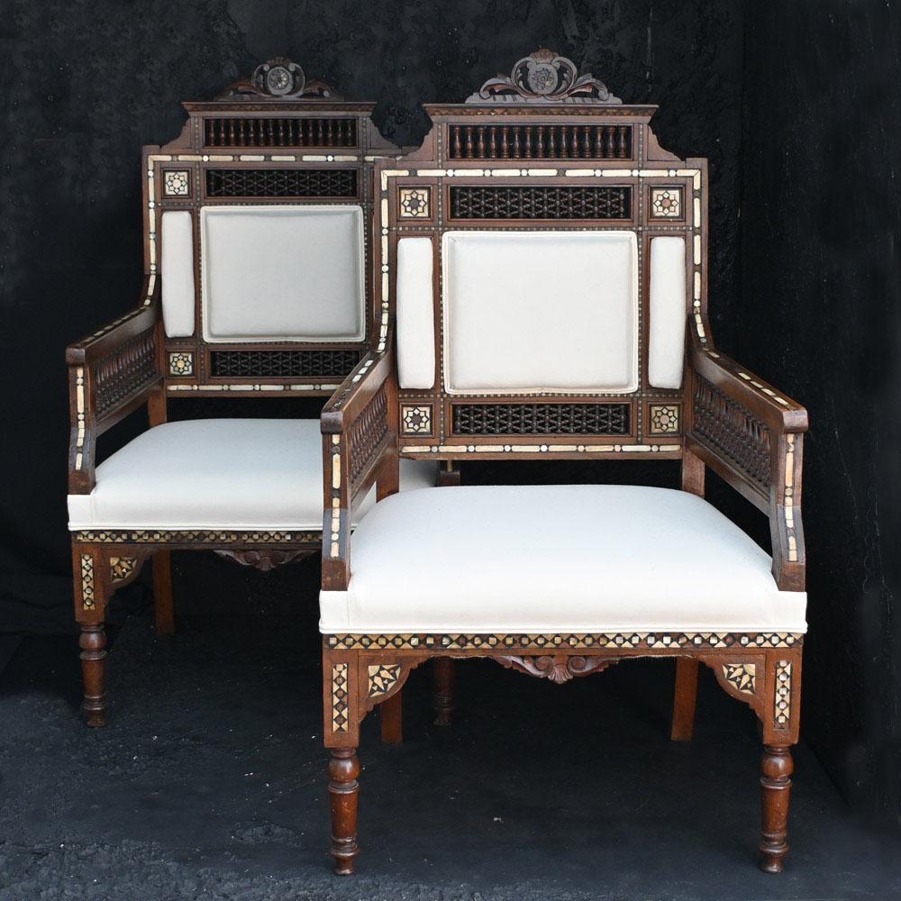 A matched pair of early 20th Century Moorish Syrian chairs  
Recently re-upholstered, this matched pair of fine quality Moorish Syrian chairs date back to the early part of the 20th Century. With fine inlaid craftsmanship and carved detail this pair