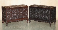 A MATCHED PAiR OF EXTRA LARGE ANTIQUE ORNATELY HAND CARVED LINEN STORAGE TRUNKS