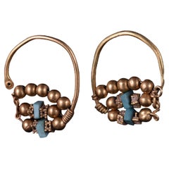 A Matched Pair of Gold Earrings